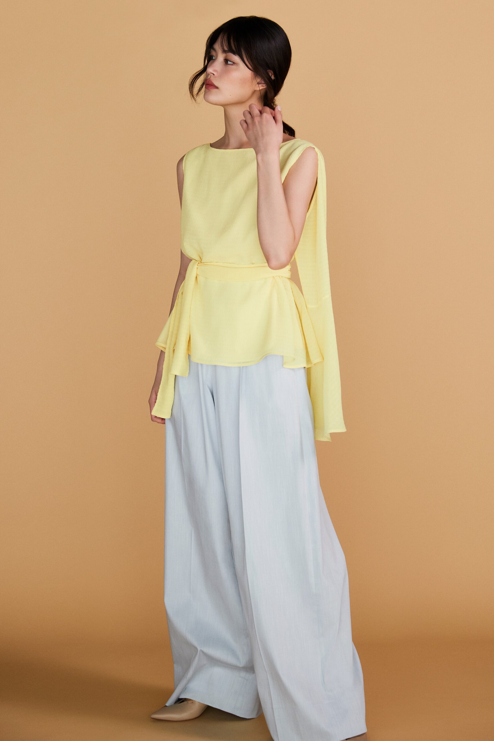 yellow layered top and light blue pants
