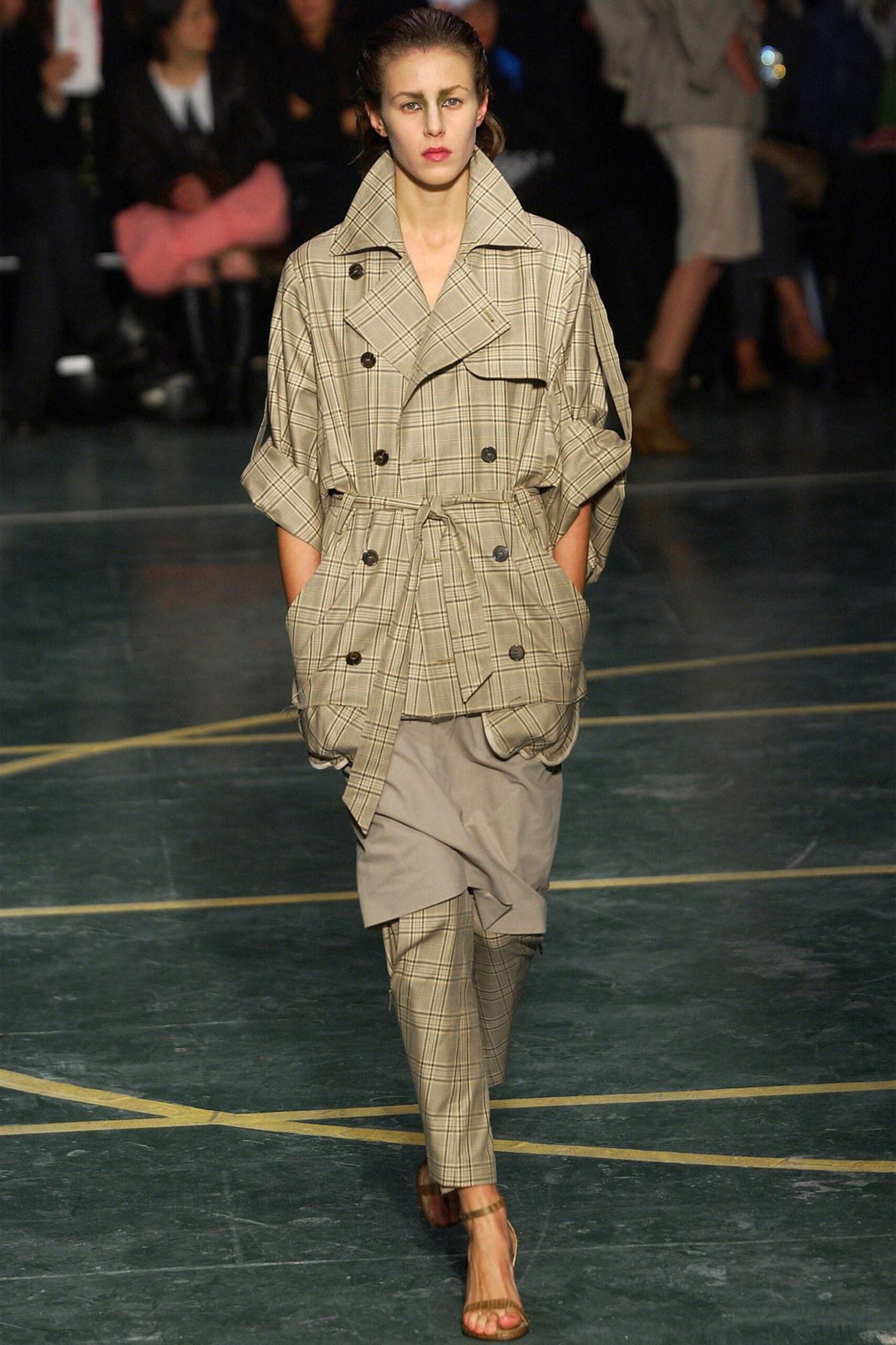 beige checked trench coat and gray pants