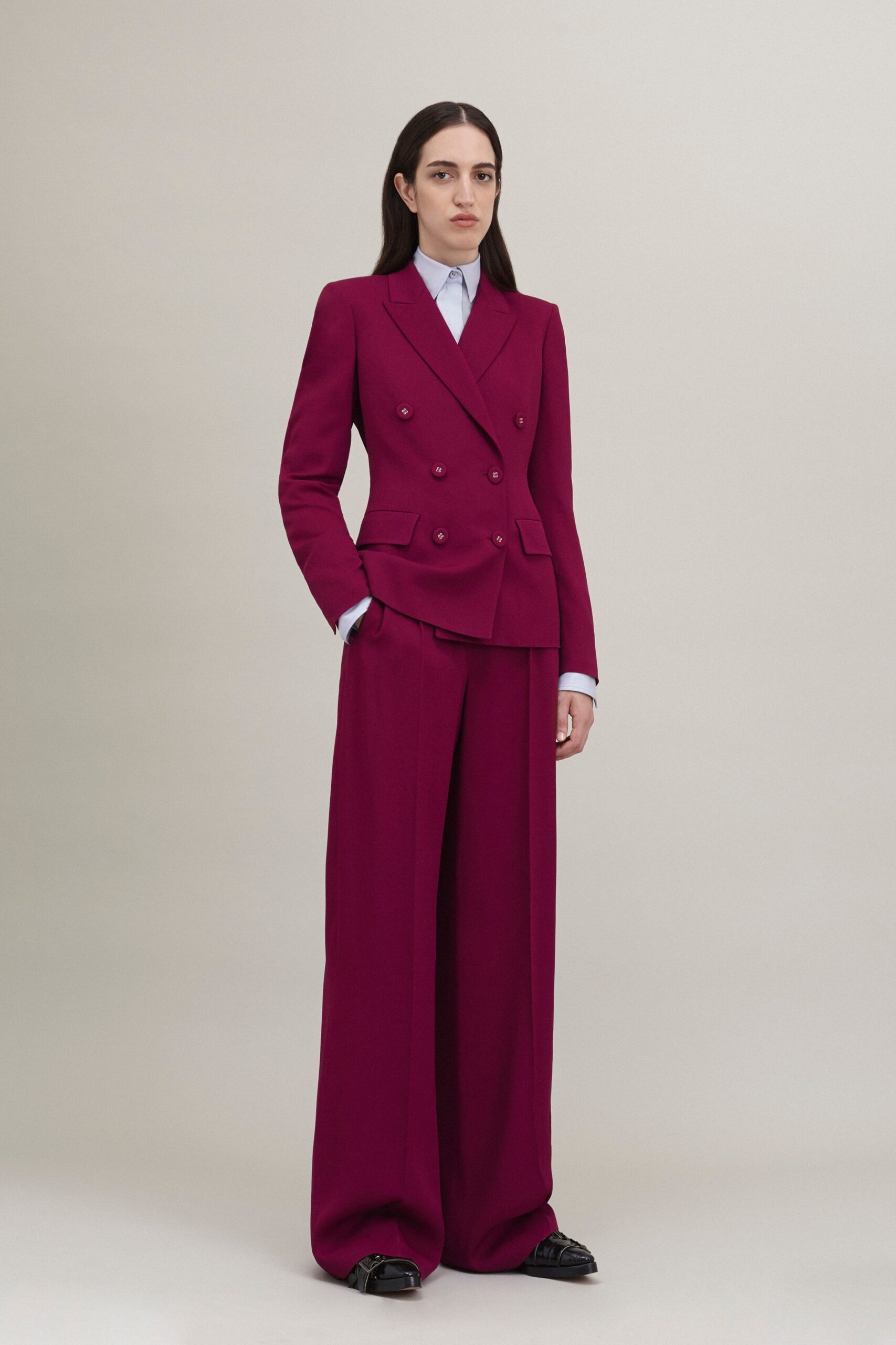 purple tailored suit with blue shirt