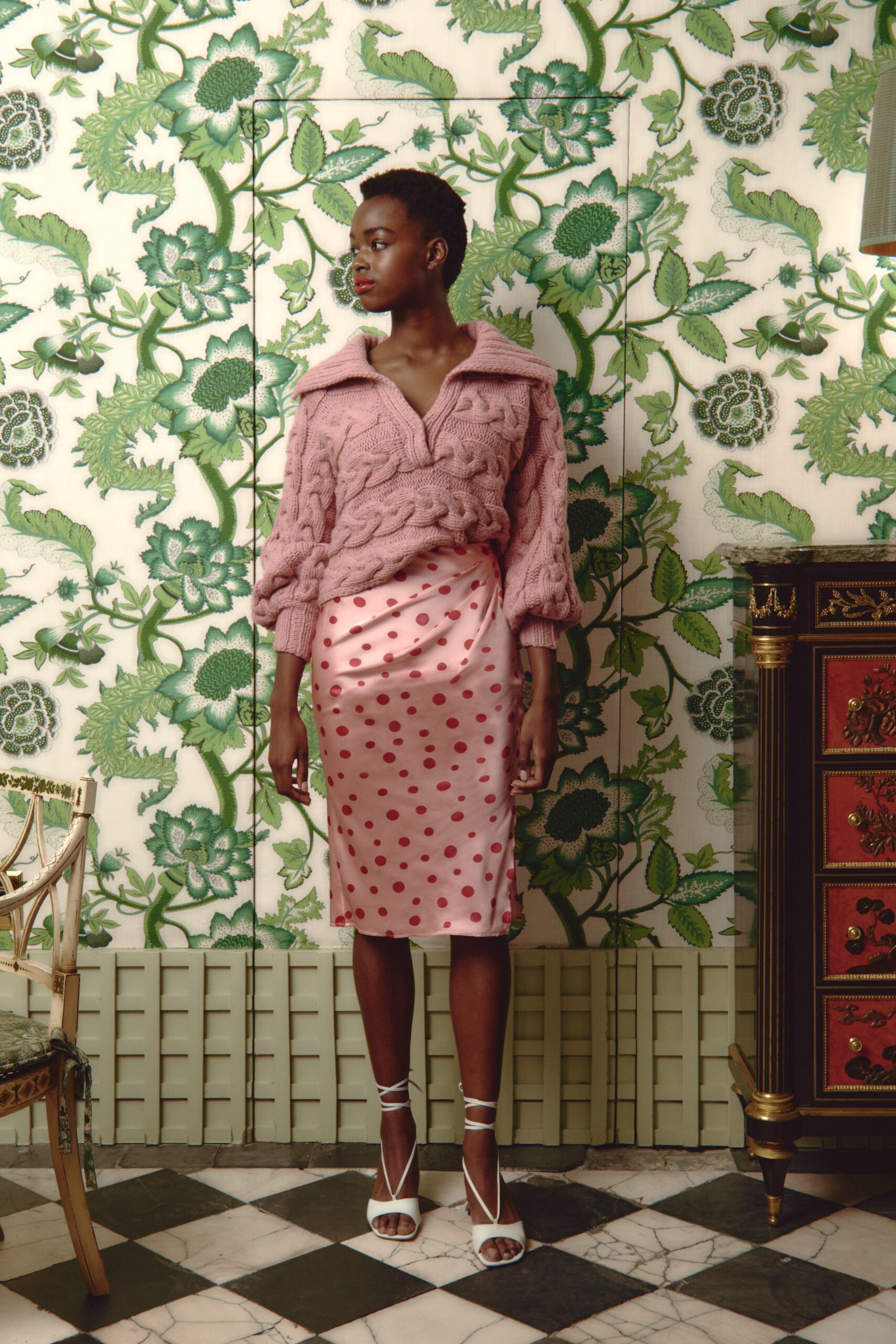 pink knitted sweater and polka-dot skirt