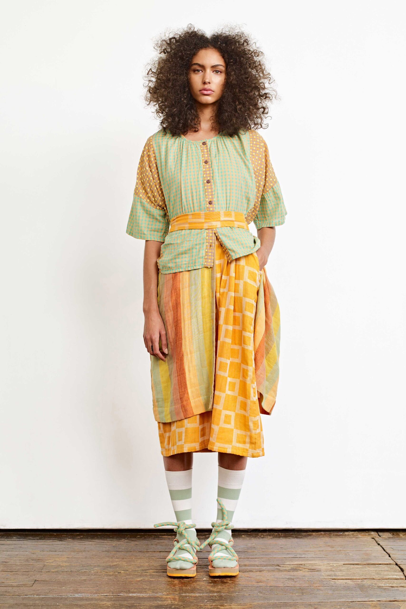 green short-sleeve collared relaxed buttoned layered top