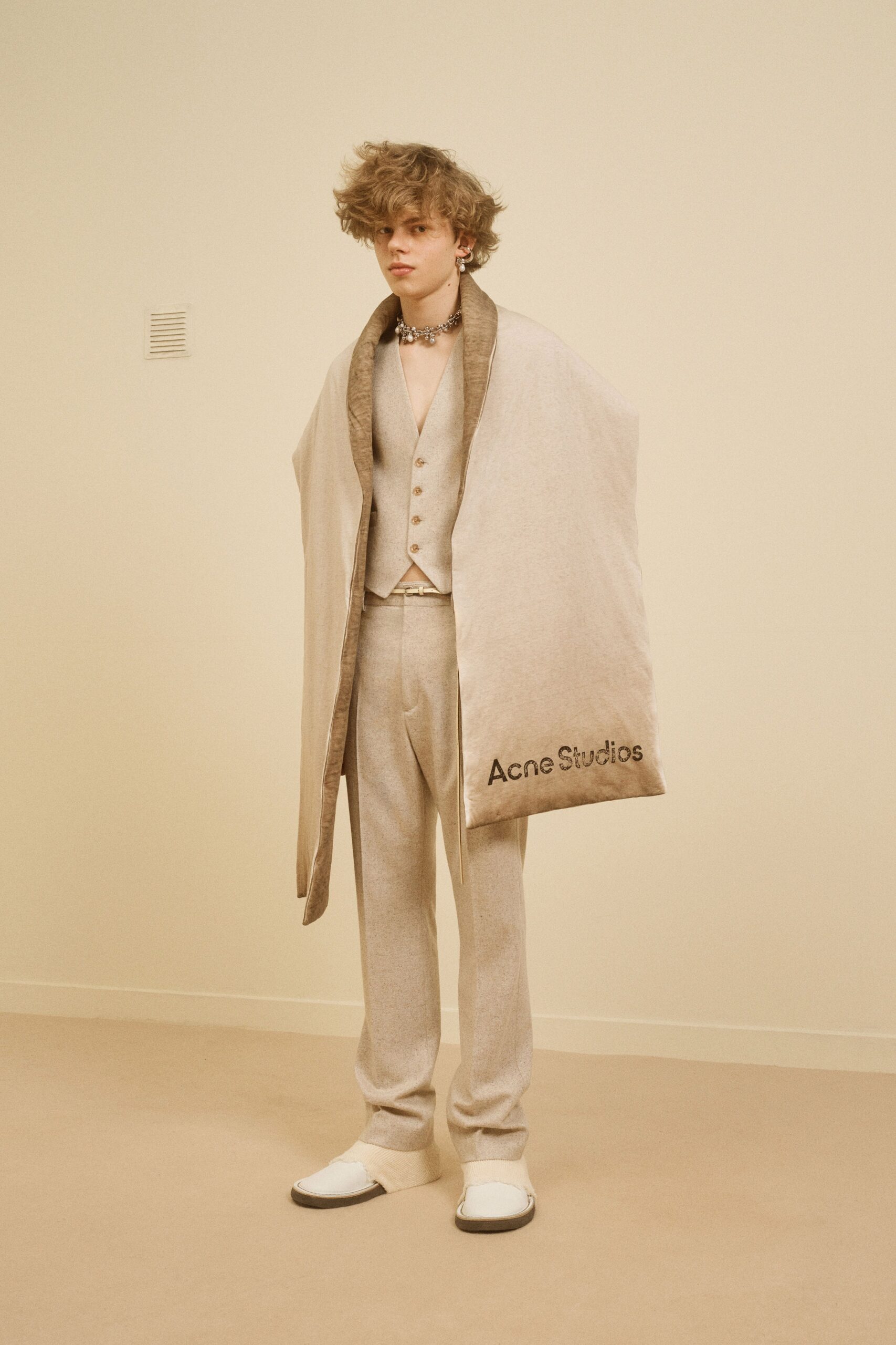 beige wool sleeveless collared fitted buttoned vest