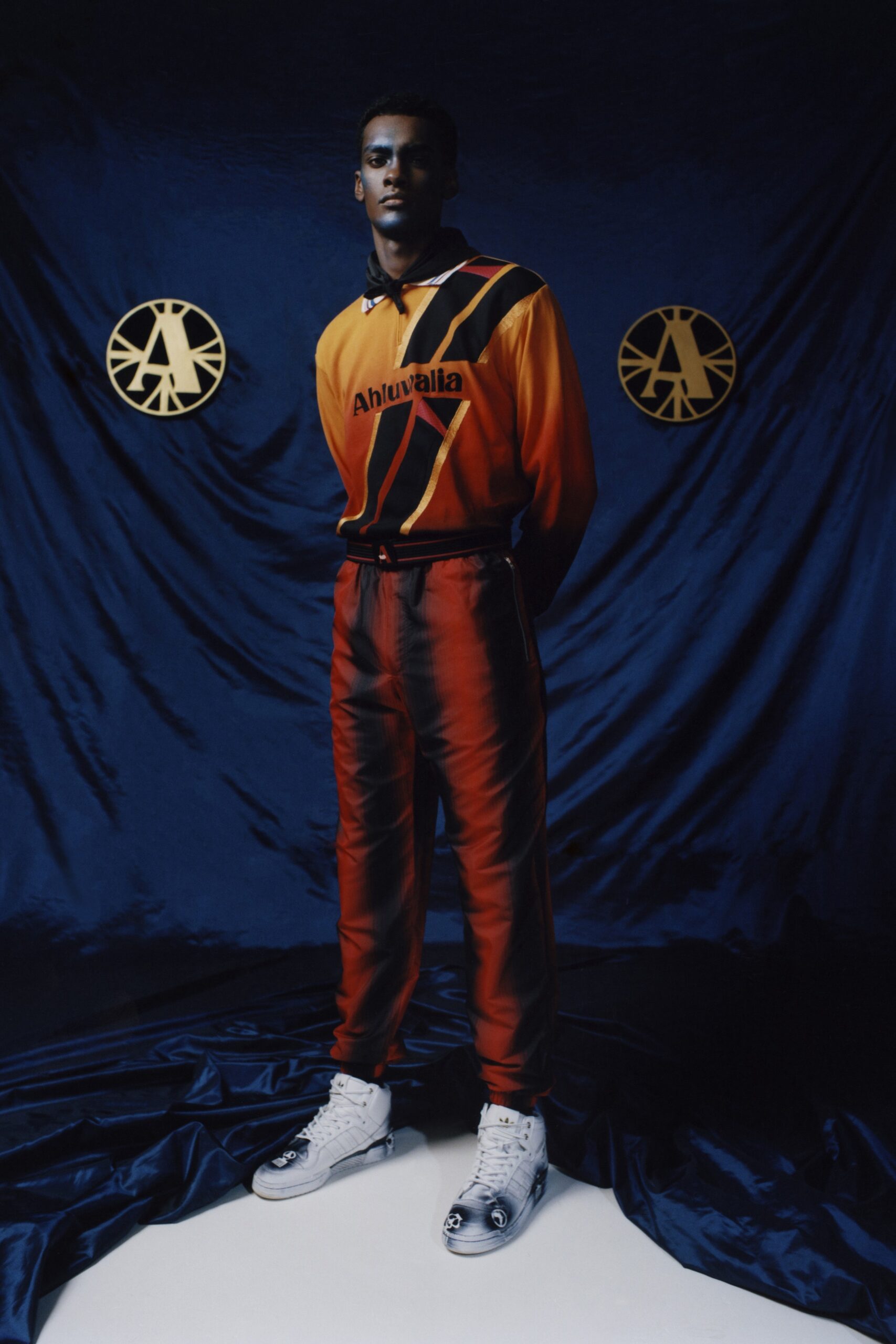 color-blocked orange and black outfit