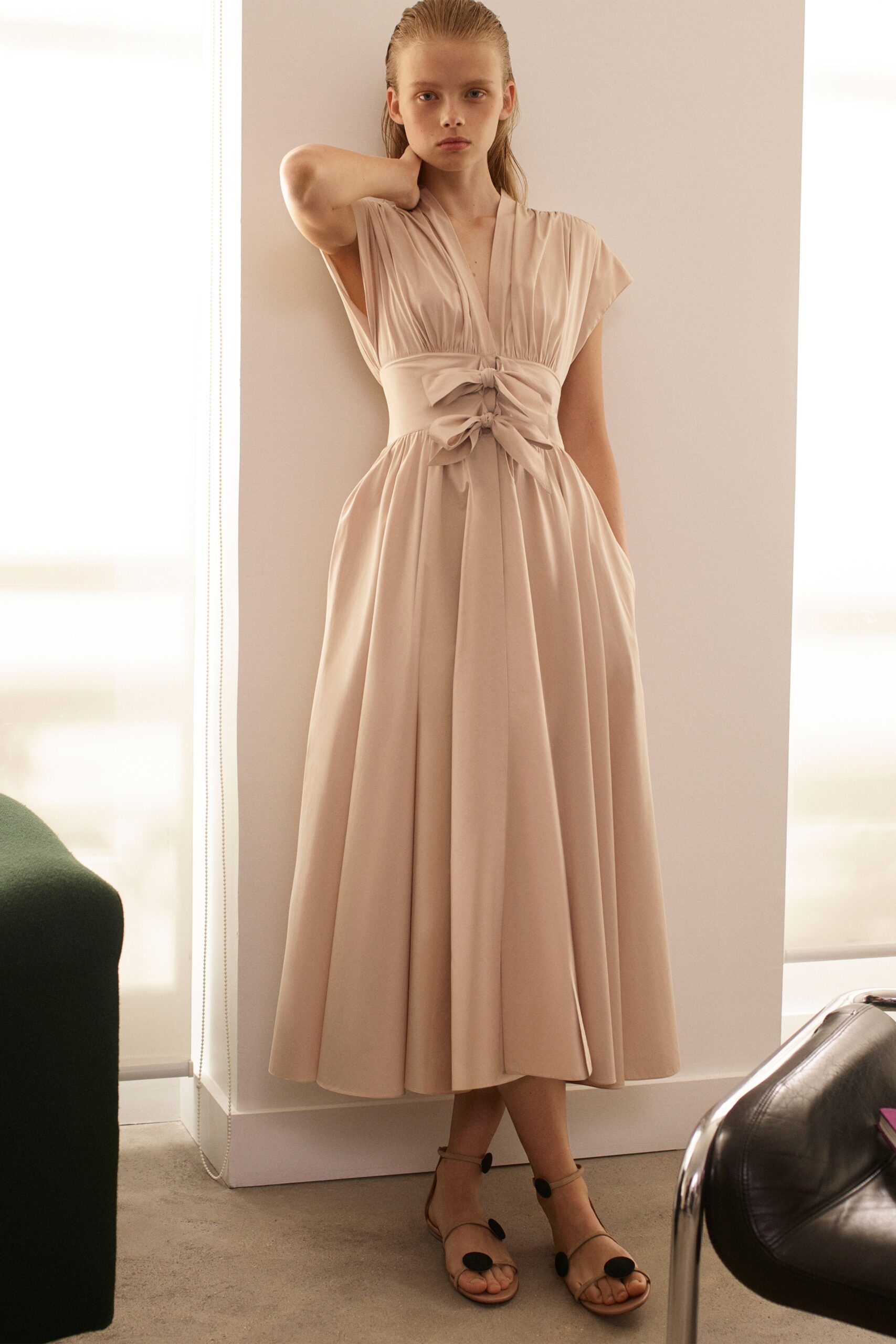 beige cotton short-sleeve v-neck fitted pleated belted dress