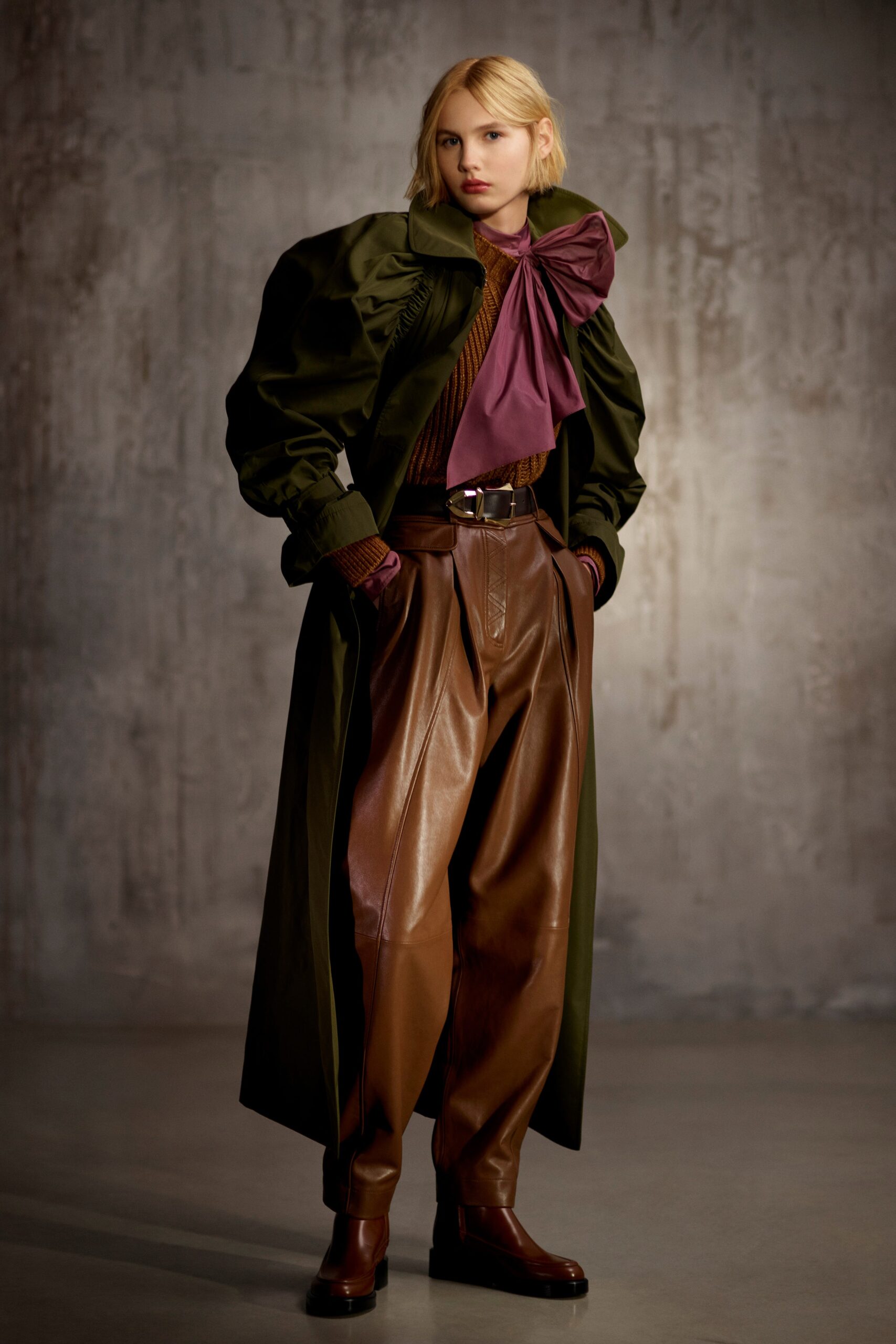 green coat brown leather pants