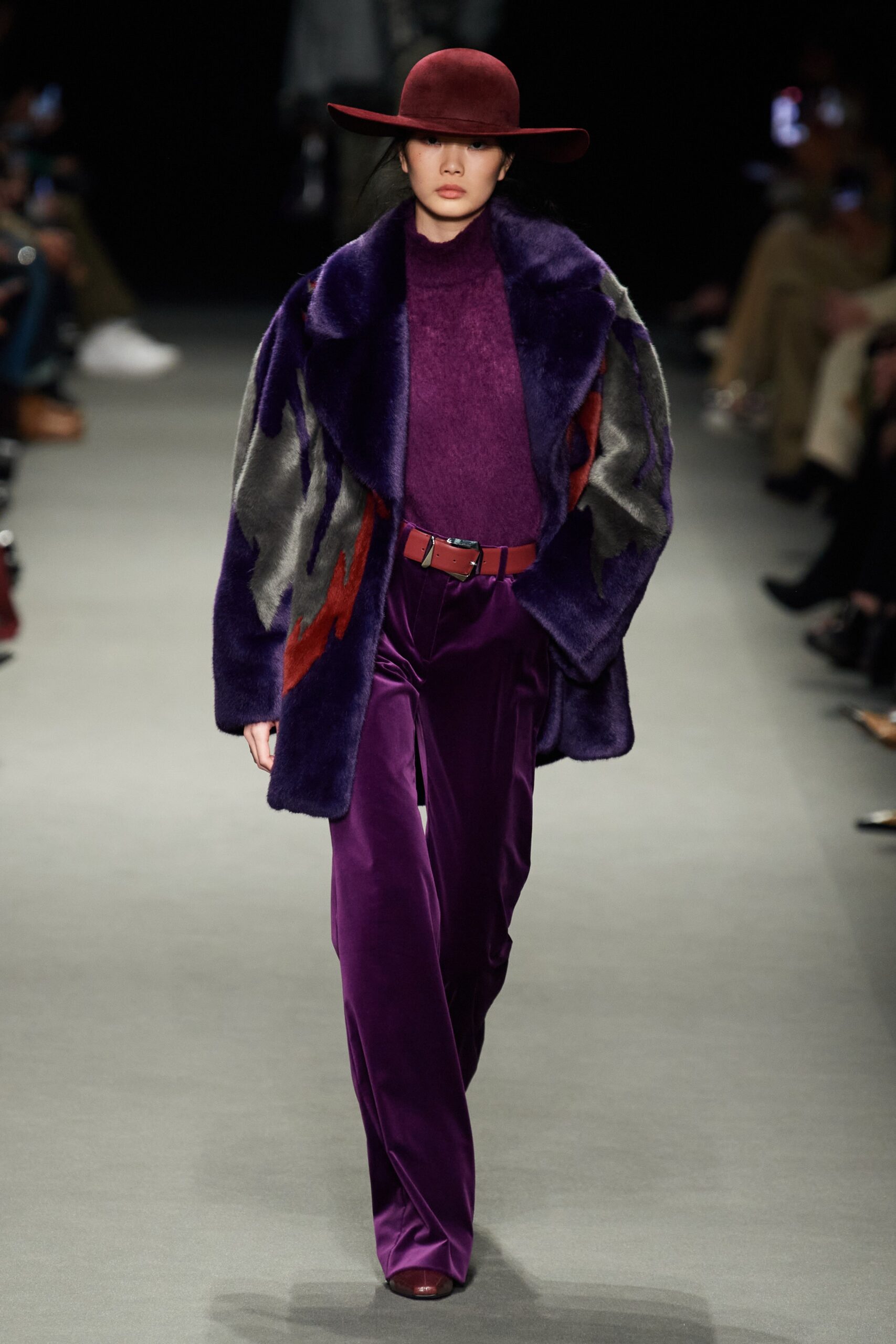 purple faux-fur coat and velvet pants