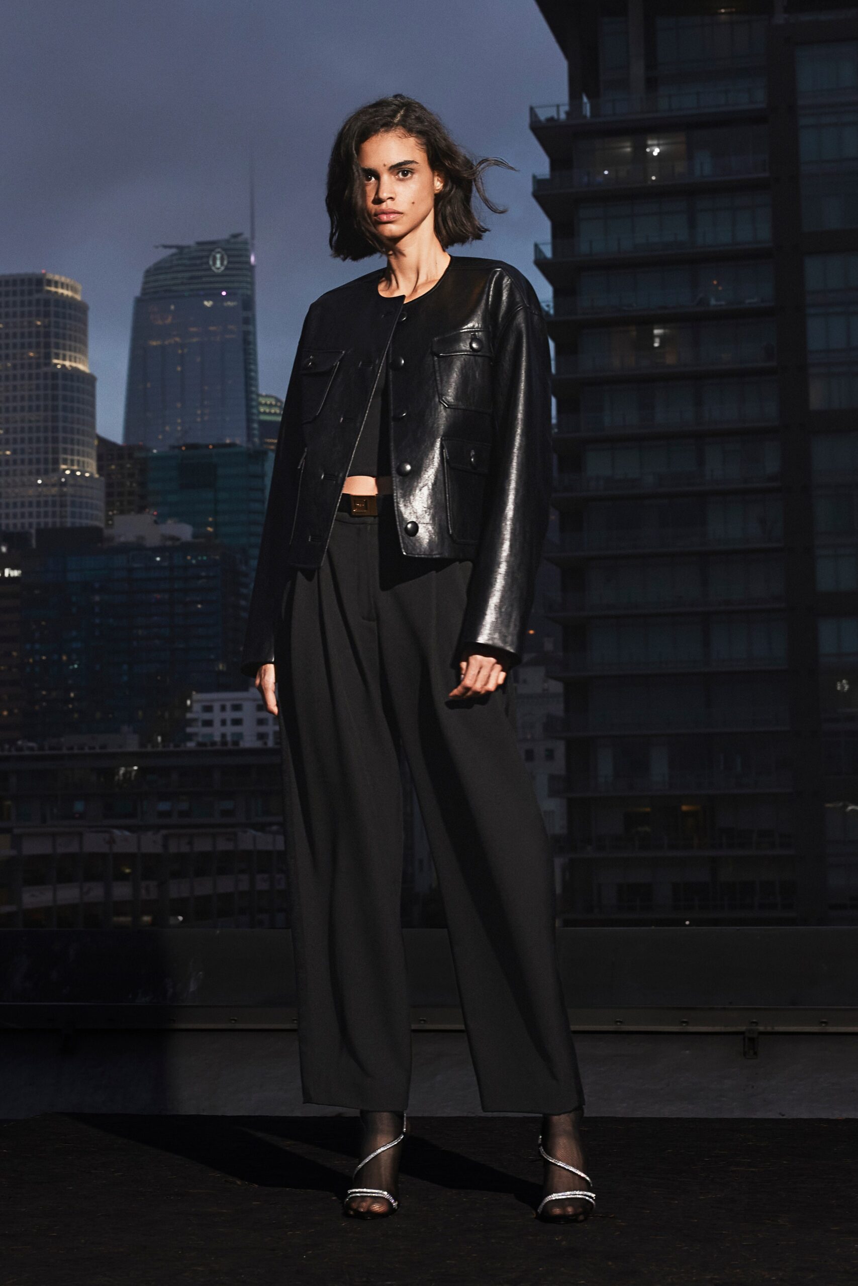 black leather fitted jacket and relaxed pants