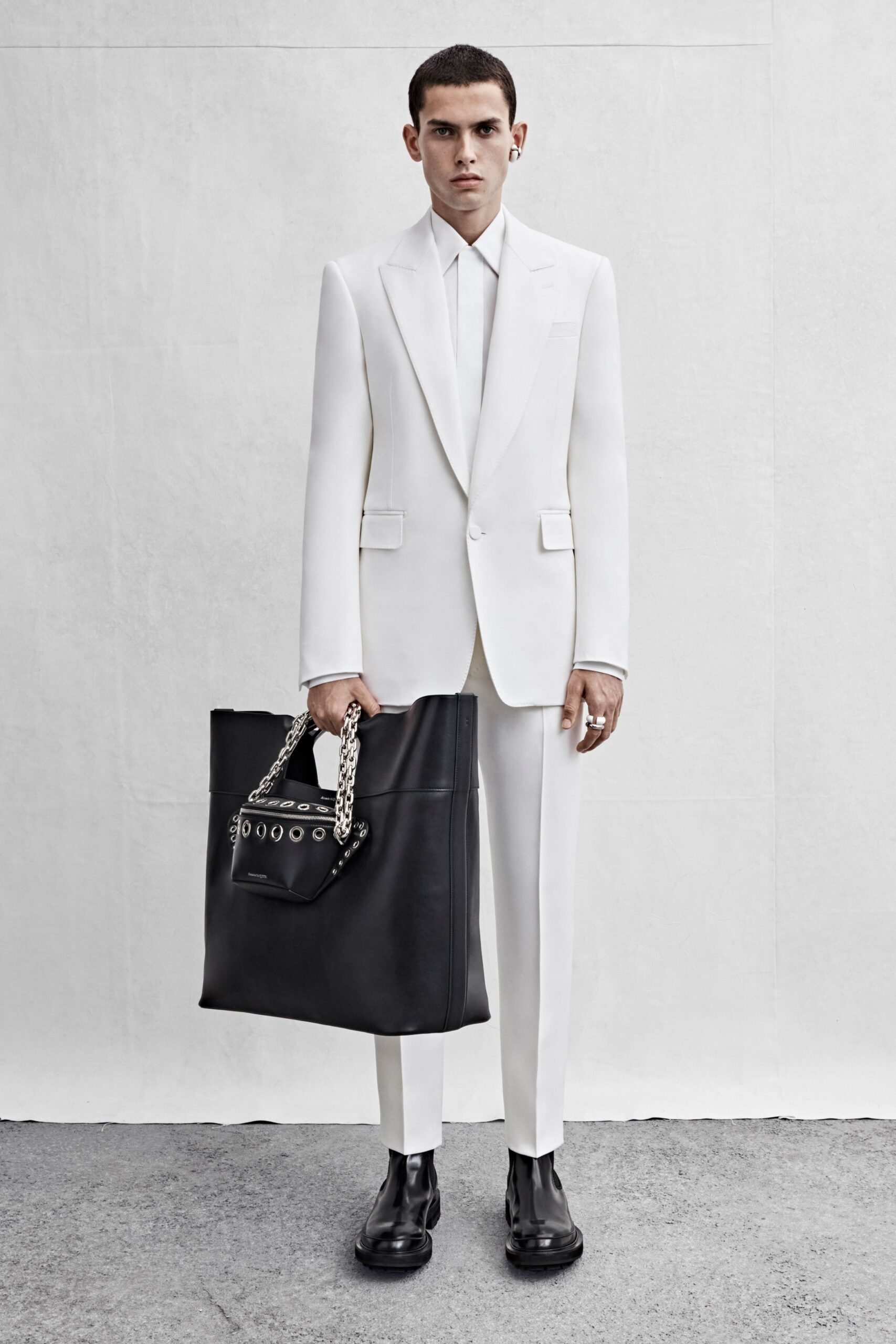 white tailored suit with black accessories