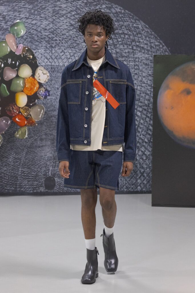 A relaxed blue denim jacket paired with matching denim shorts featuring a collared design.