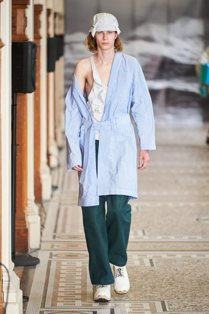 blue and white relaxed coat with green pants