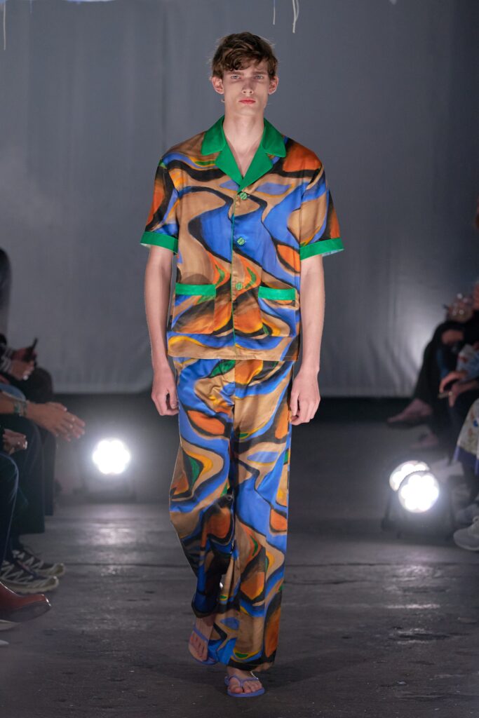A relaxed-fit printed shirt with short sleeves and matching pants in vibrant colors.