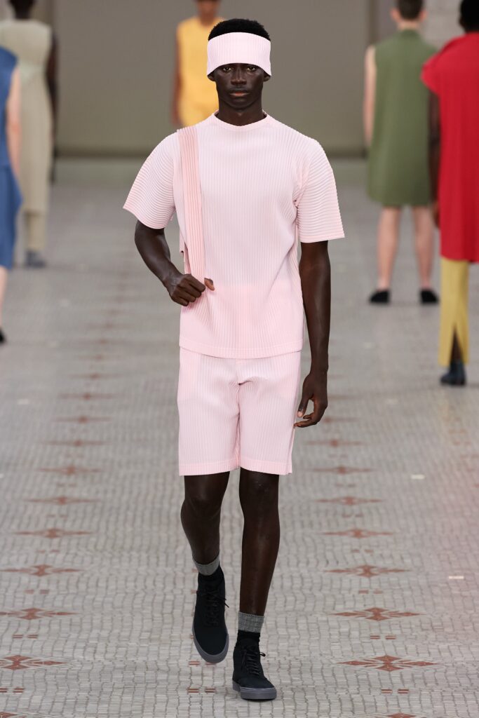 A relaxed pink striped shirt paired with matching shorts for a casual look.