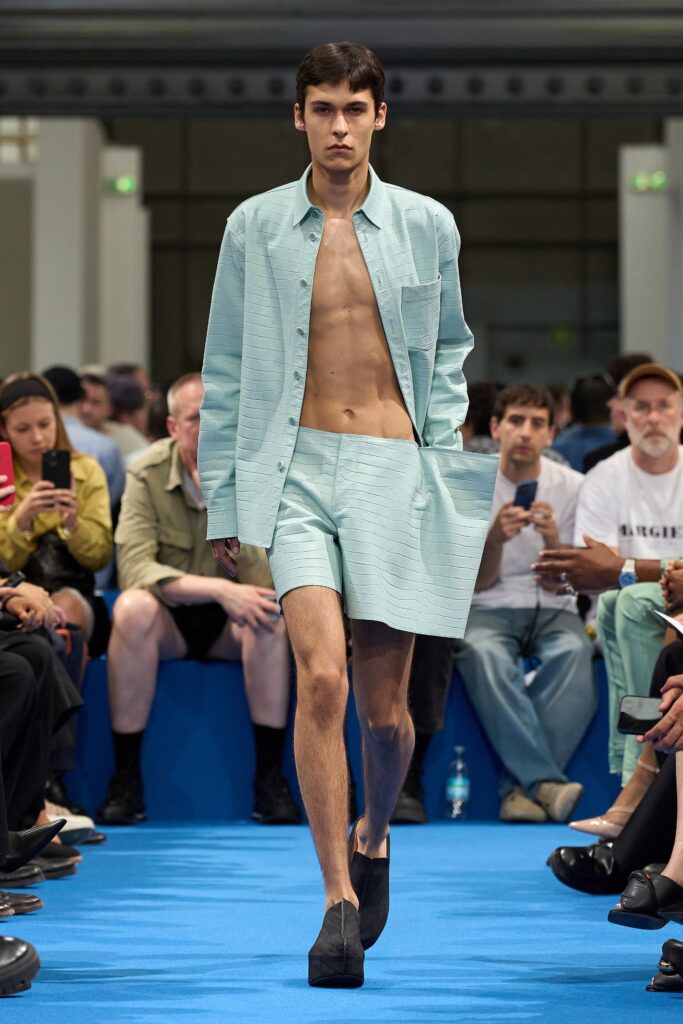 A fitted blue cotton long-sleeve shirt paired with matching fitted shorts.