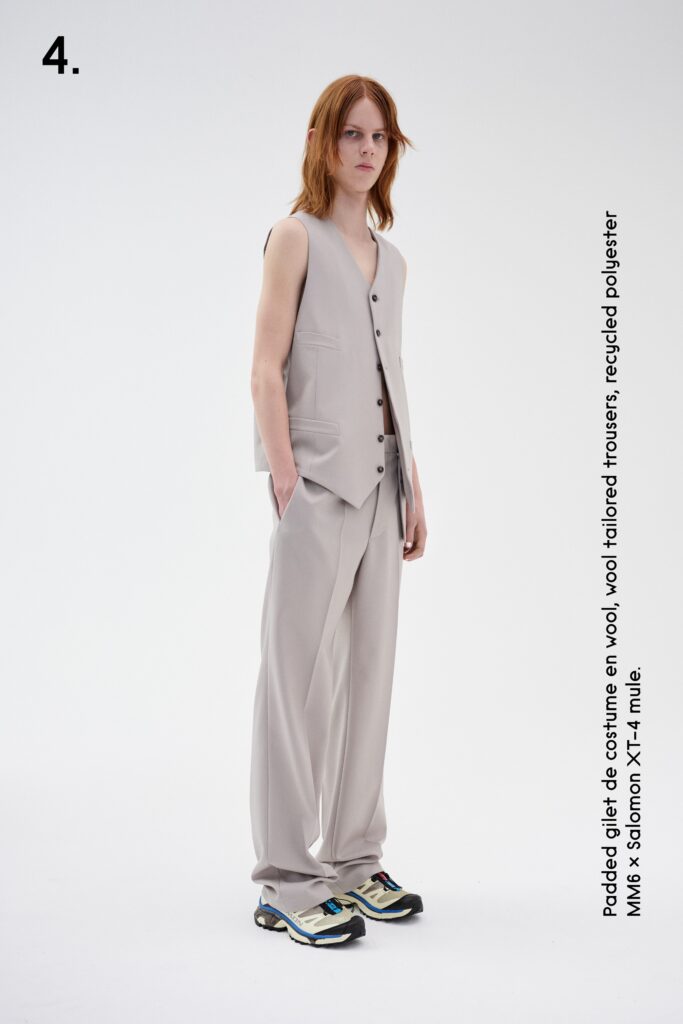 A tailored beige vest paired with straight-leg trousers for a sophisticated look.