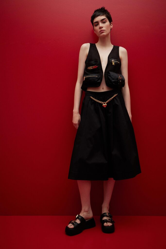 black fitted vest and midi skirt