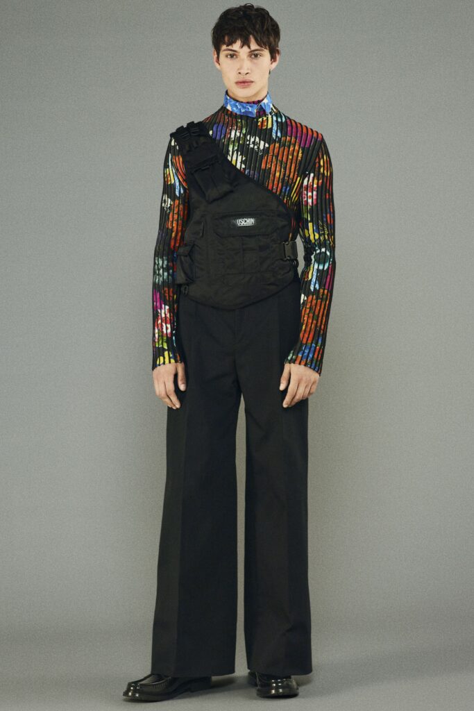 multi-colored fitted top with black pants