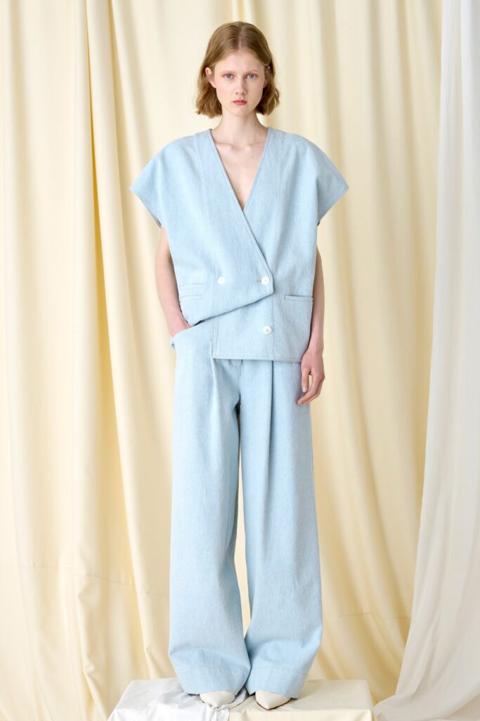 A relaxed blue cotton top with a V-neck and wide-leg pants.