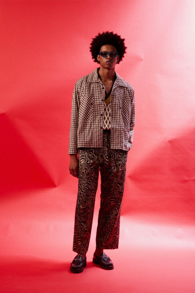 A relaxed brown printed jacket with long sleeves and matching pants.