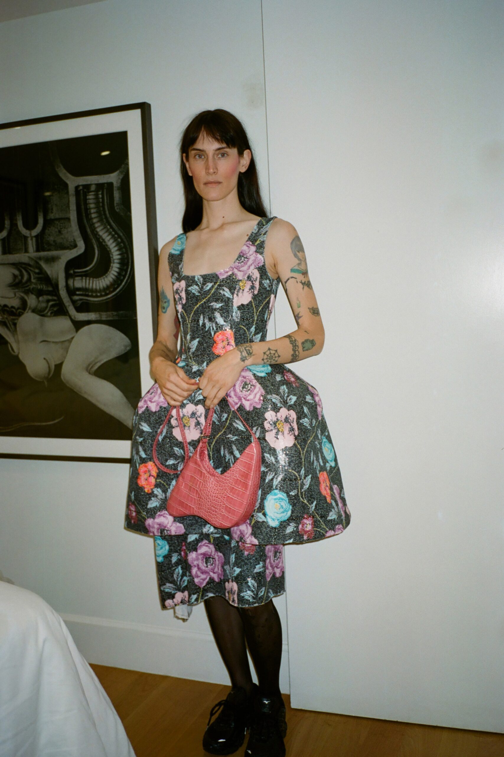 A fitted multicolor sleeveless dress with a V-neckline and flared silhouette.