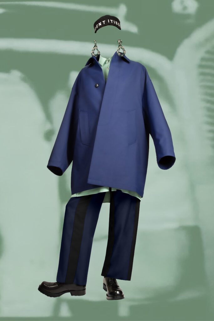 An oversized blue jacket paired with straight-leg pants, featuring a collared design.
