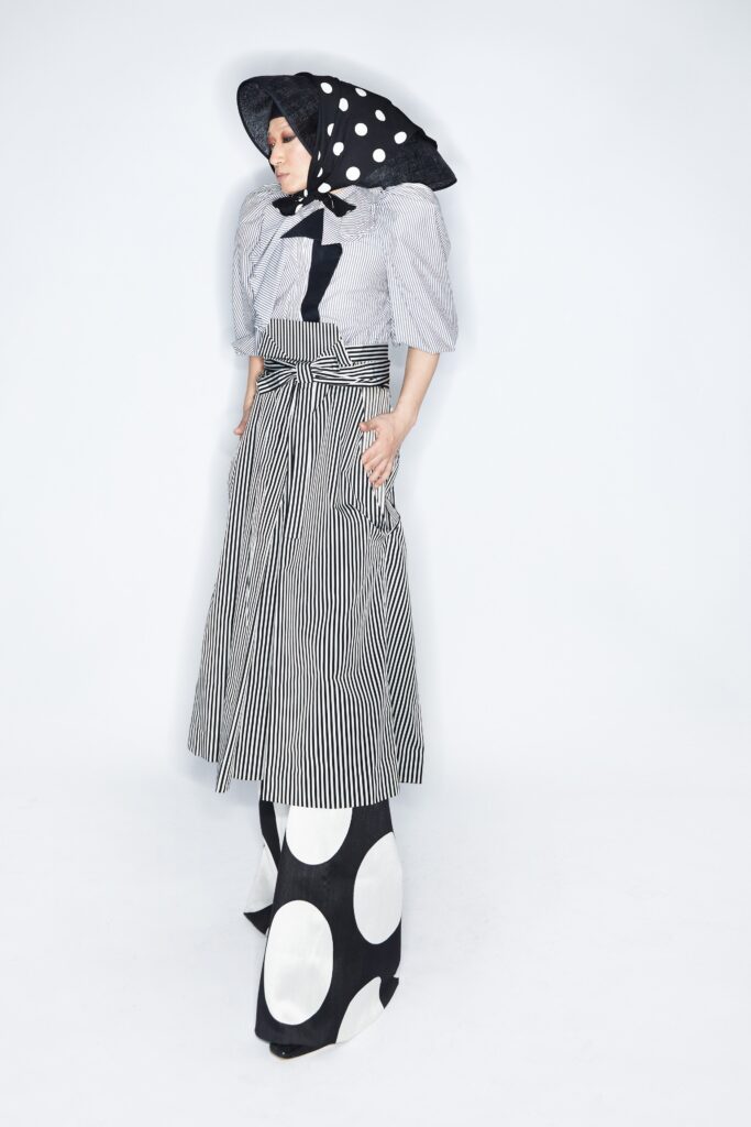 A relaxed cotton dress with a striped top and polka-dot details.