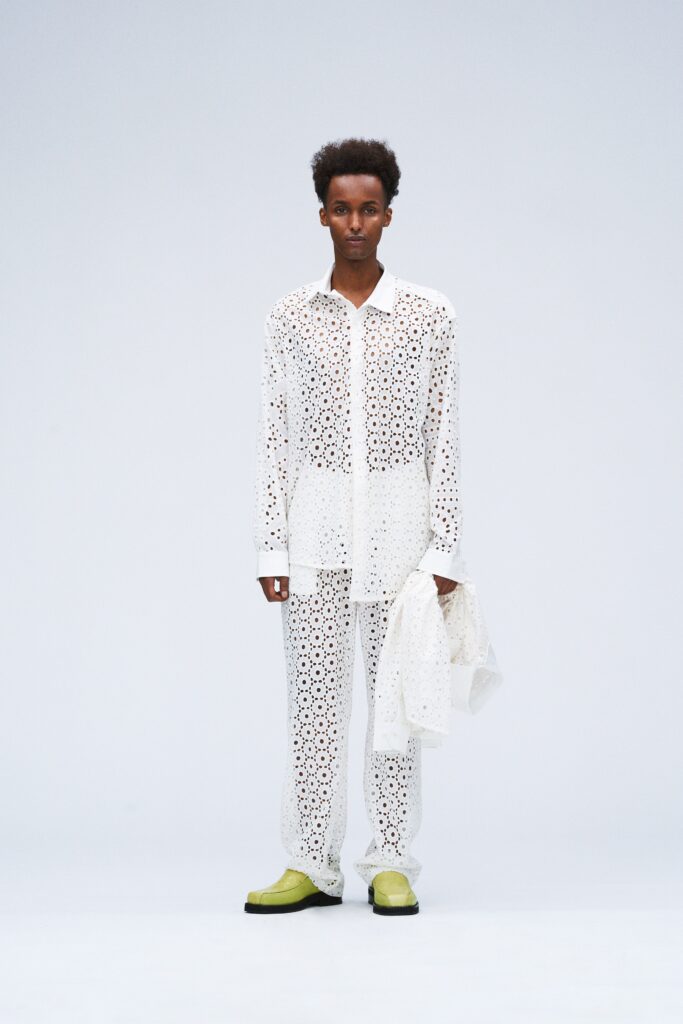 white embroidered shirt and pants