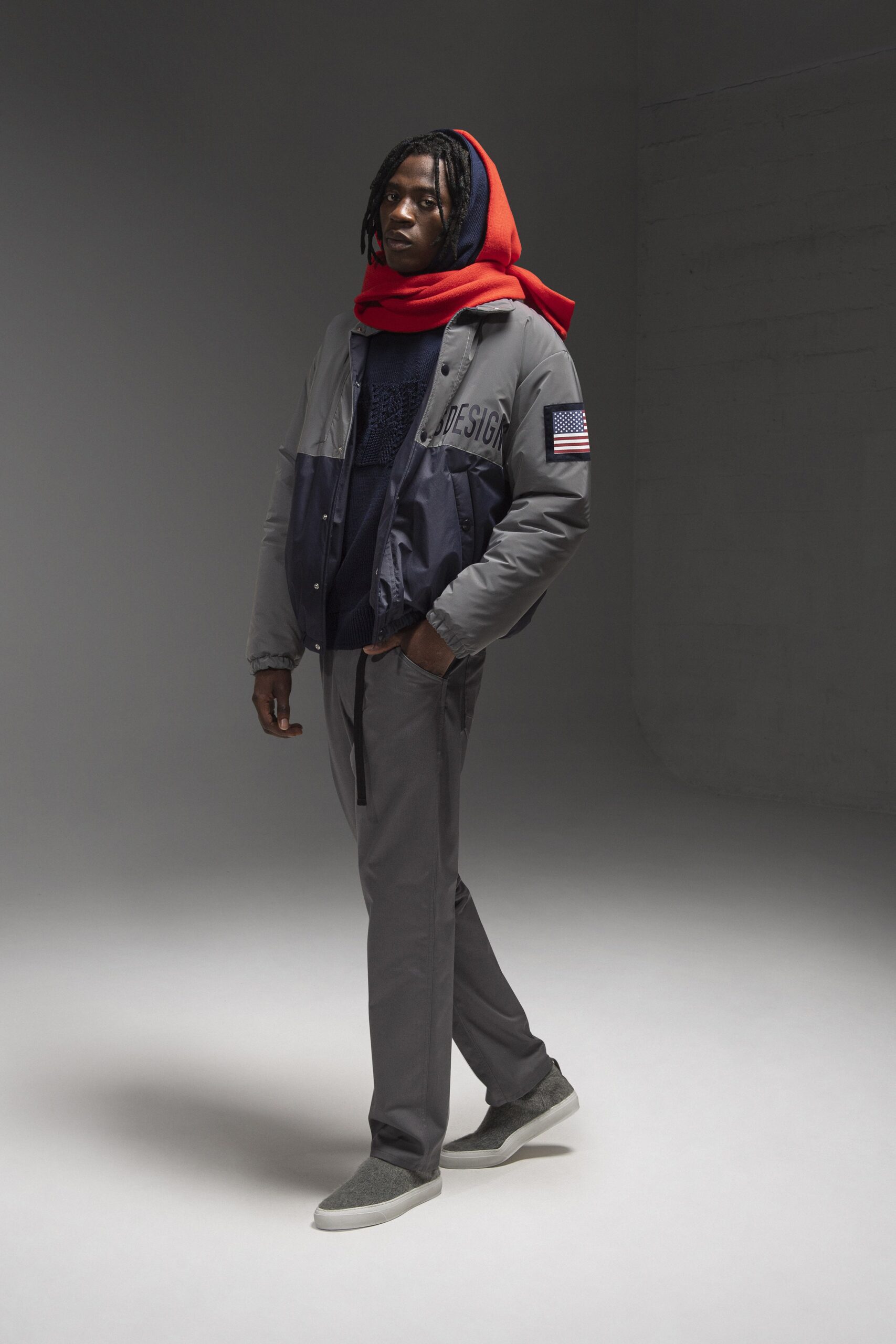 A relaxed gray hooded jacket paired with matching pants in a casual style.