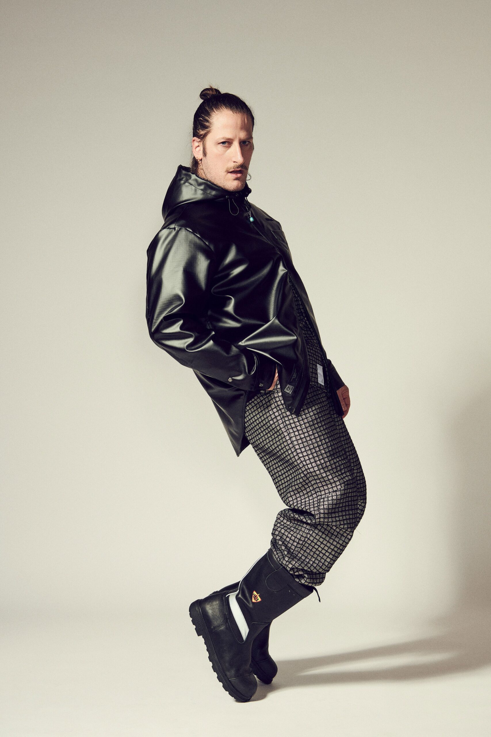 black vinyl jacket gray checkered pants