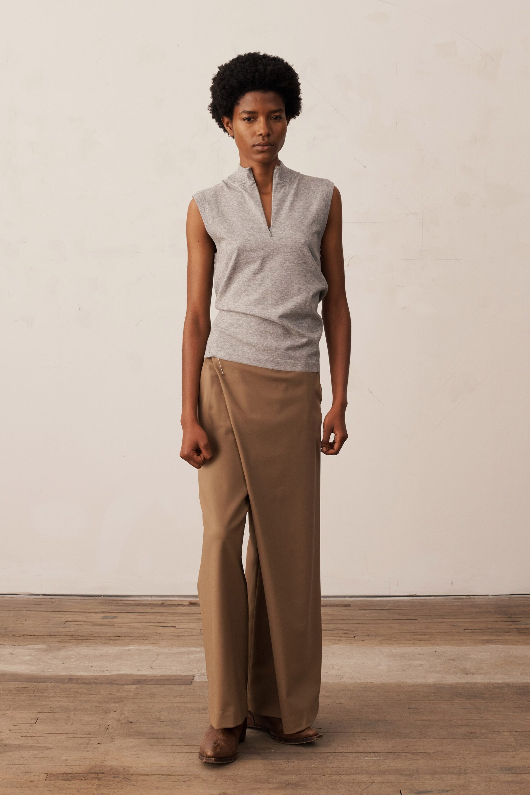 gray fitted top and brown relaxed pants