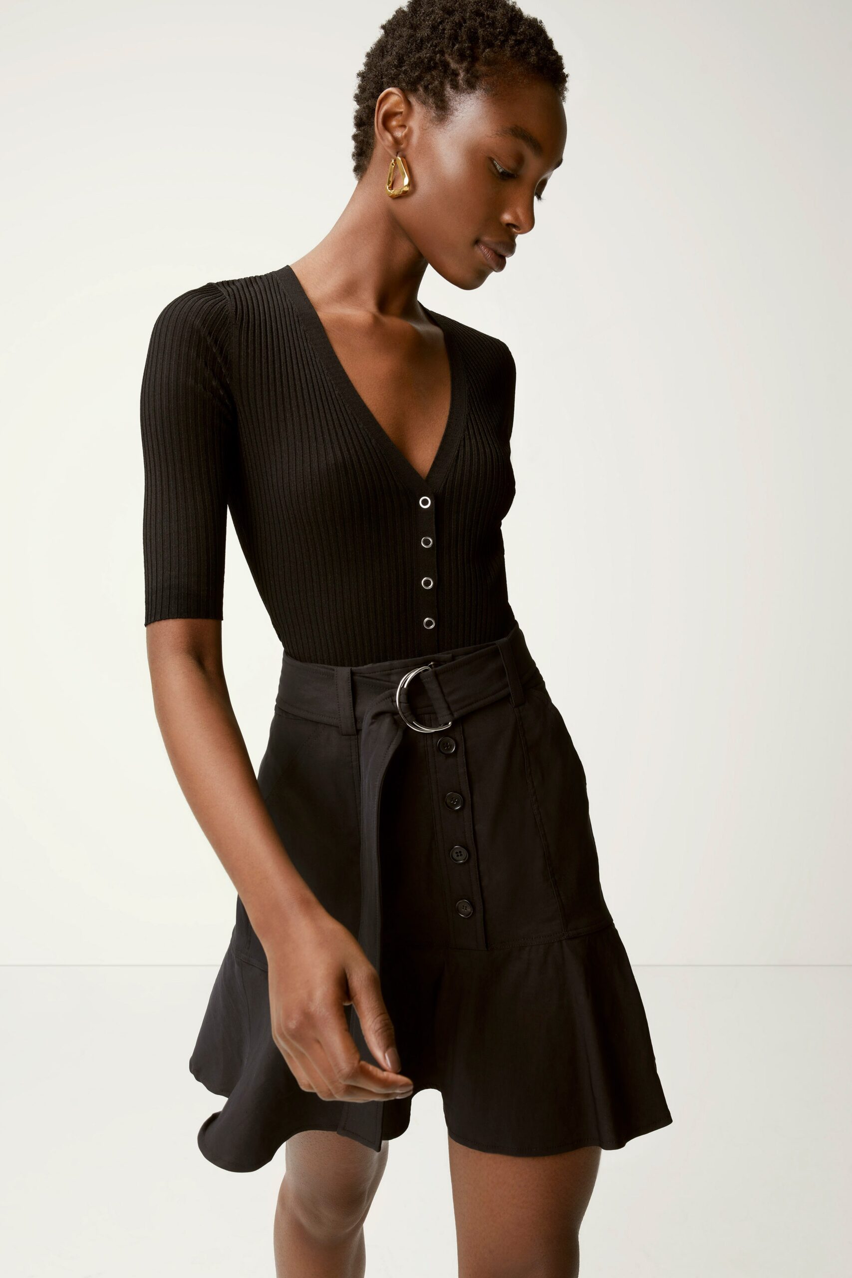 black cotton fitted high-waisted flared buttoned mini skirt