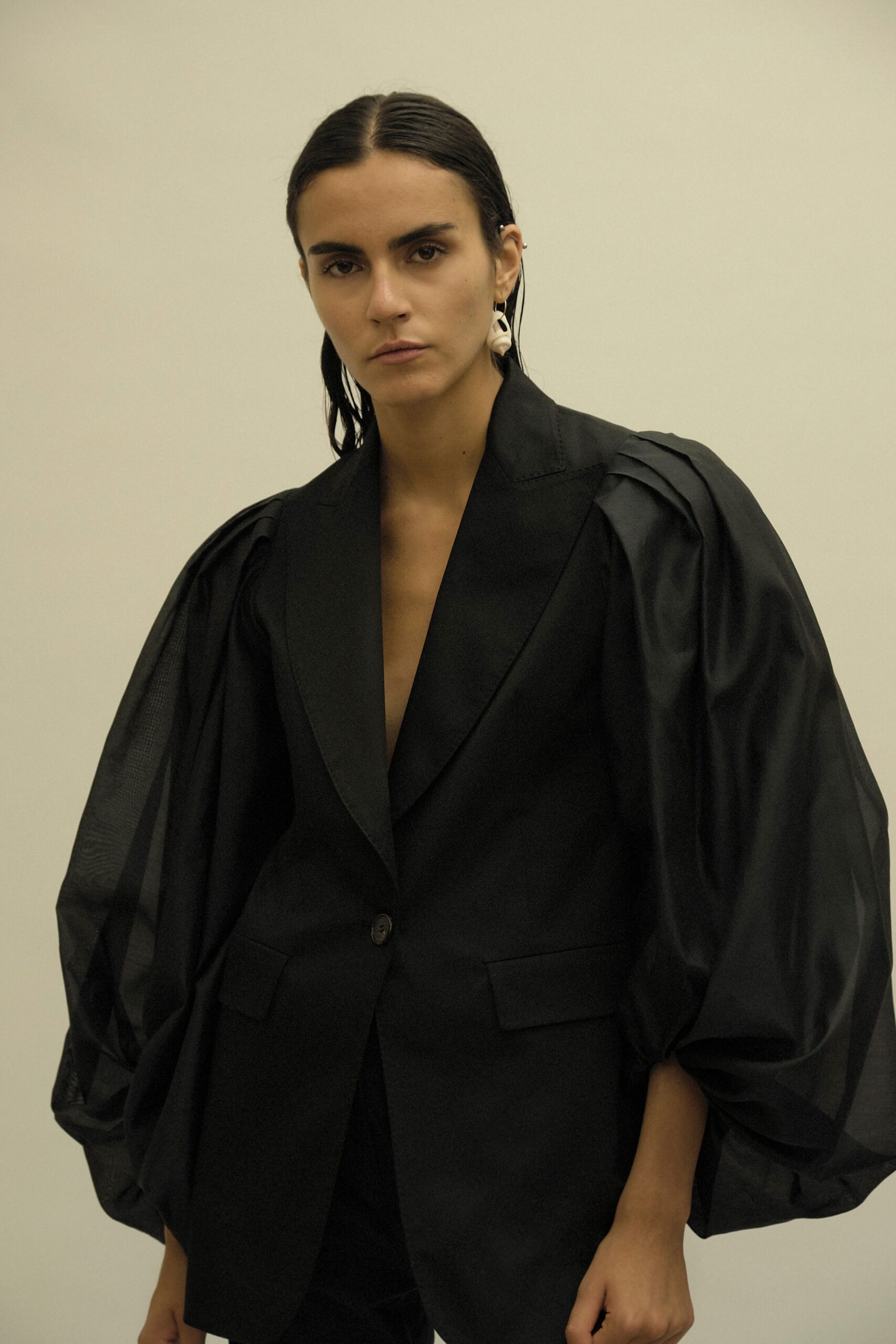 black fitted blazer with puffed sleeves