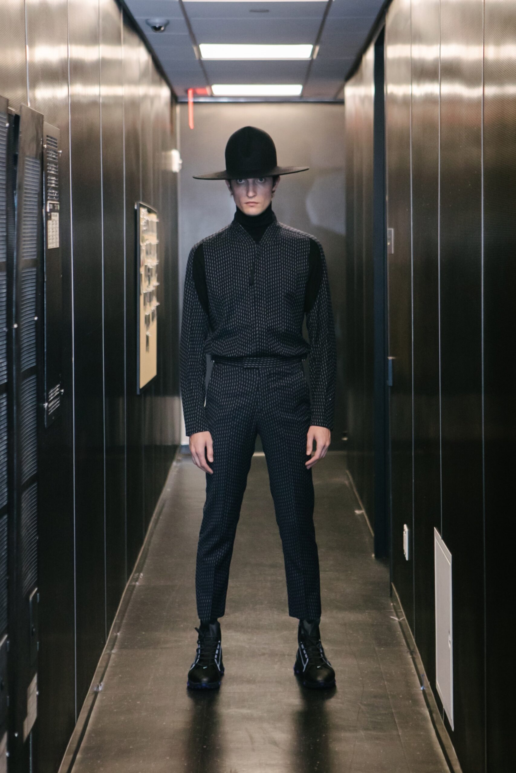 black fitted suit with hat