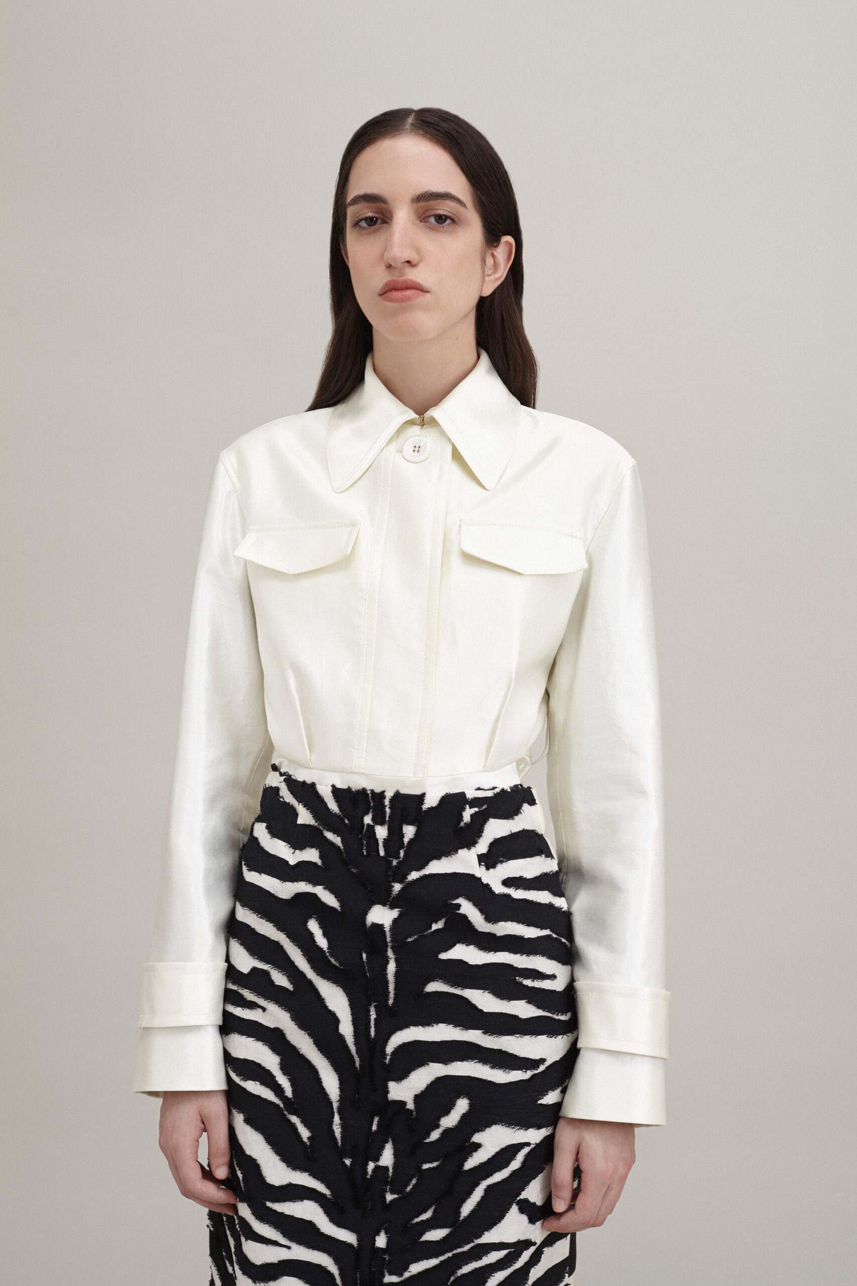 white silk fitted shirt with animal-print skirt