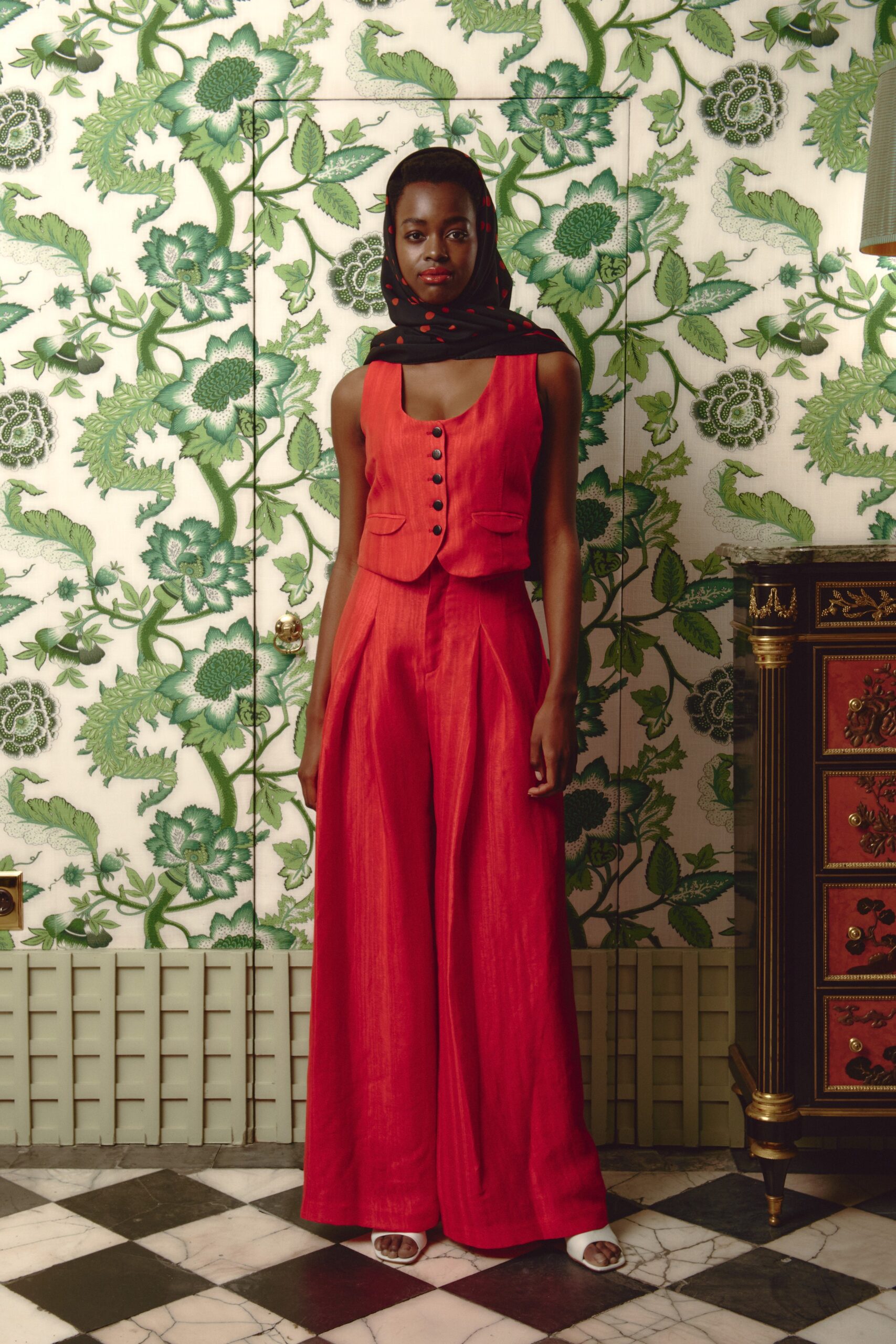 red fitted top and wide-leg pants