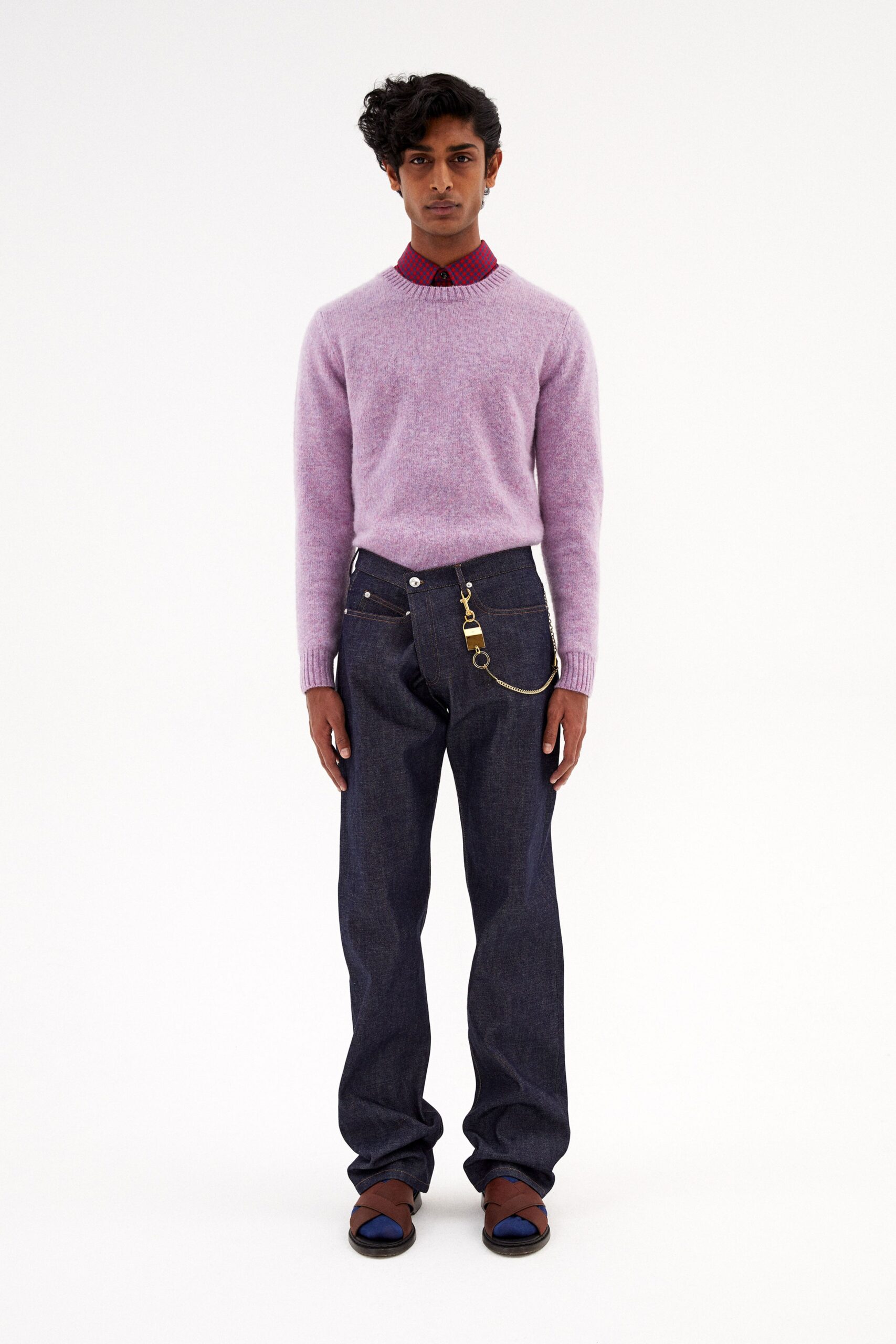 pink wool fitted sweater and blue denim pants