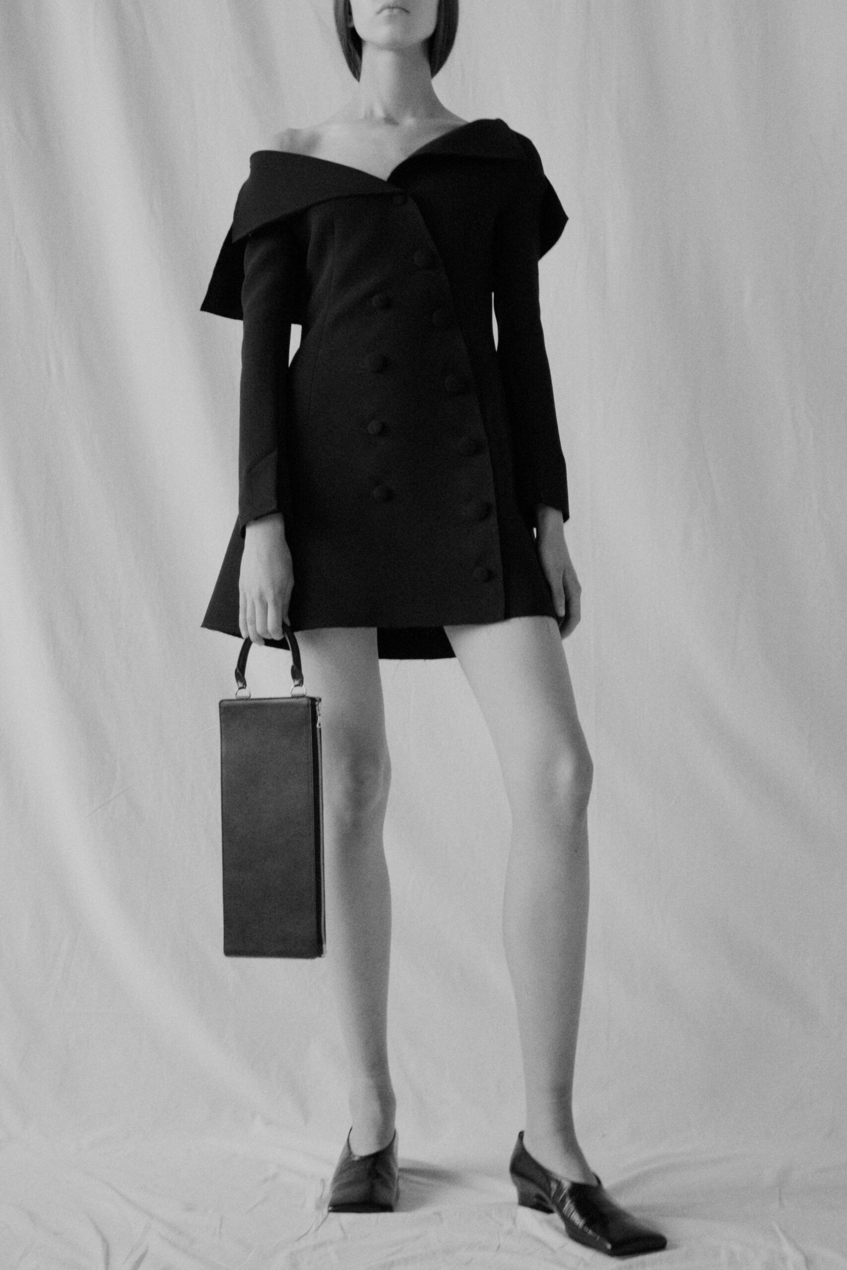 black wool long-sleeve off-shoulder fitted buttoned a-line dress