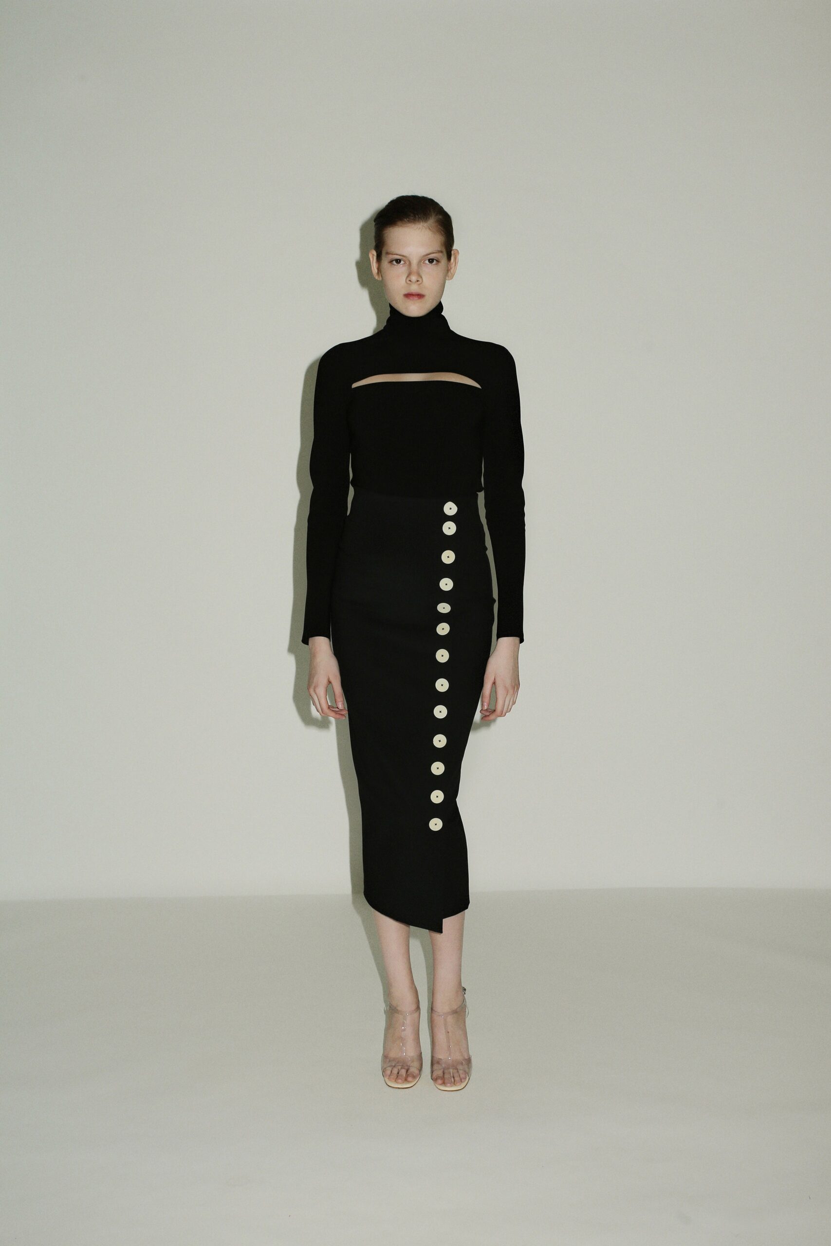 black fitted top and midi skirt