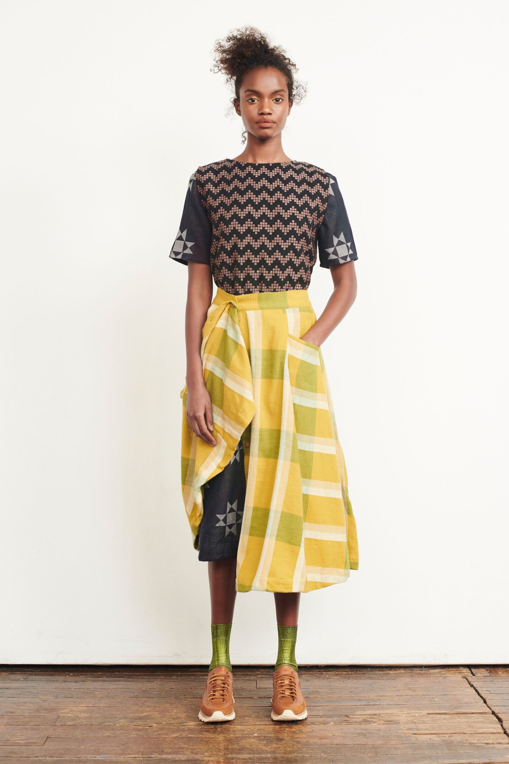 embroidered black cotton top with pleated skirt