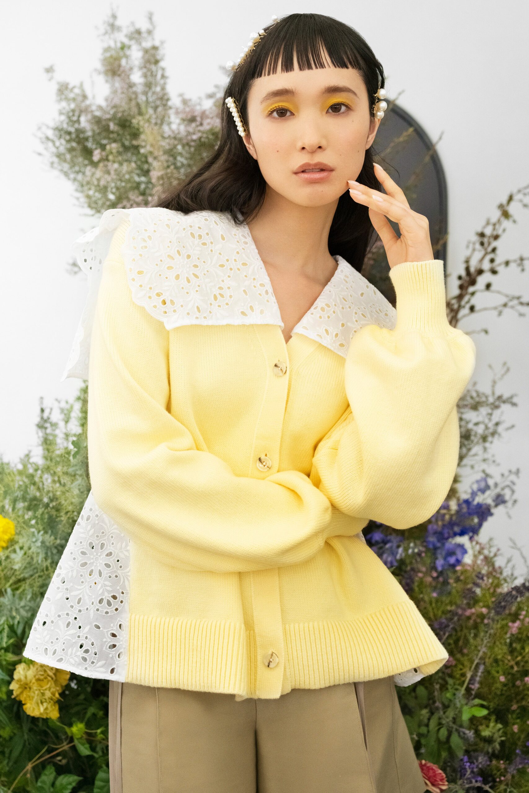 yellow cardigan with beige pants