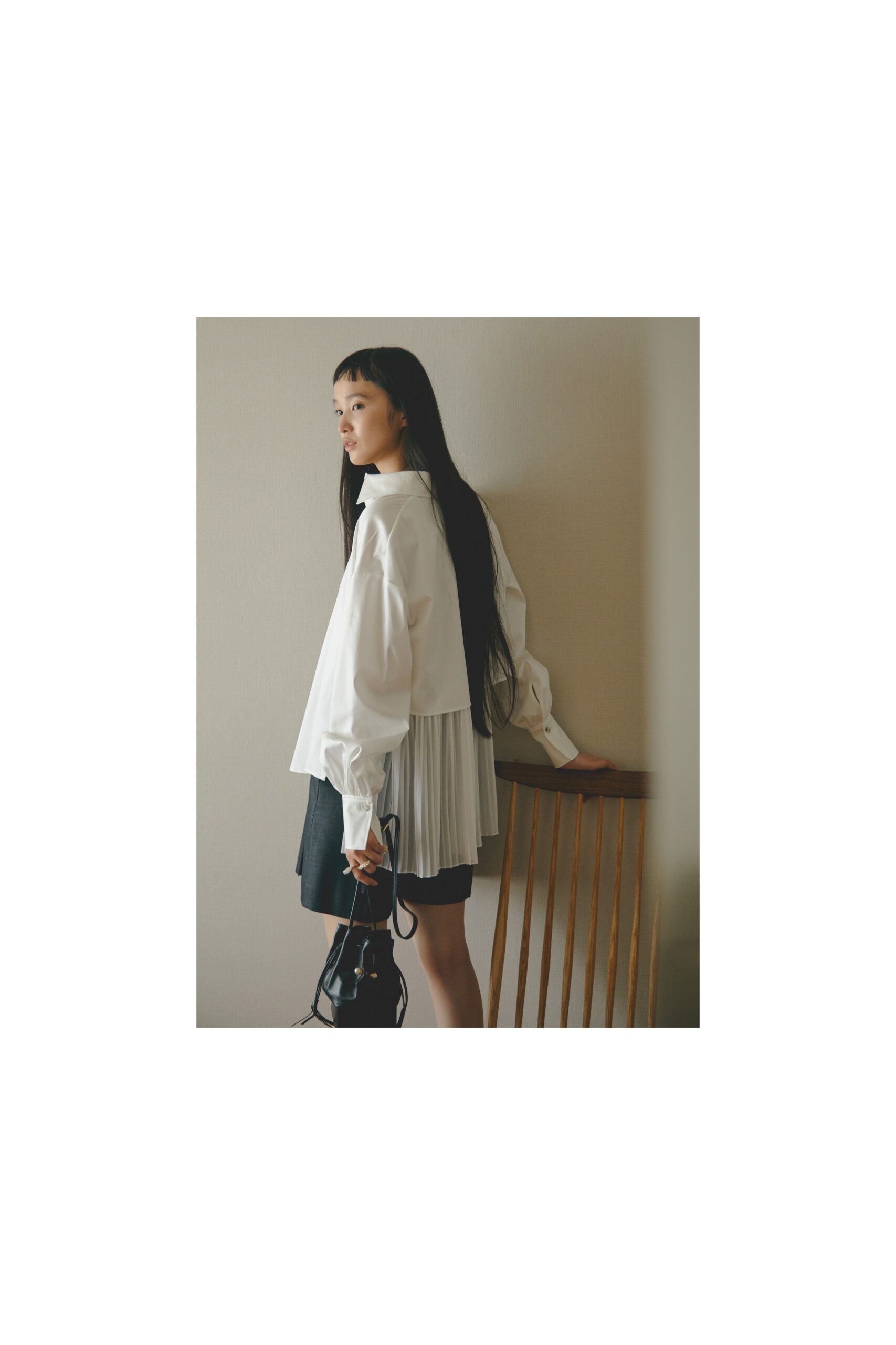 white relaxed blouse and black skirt