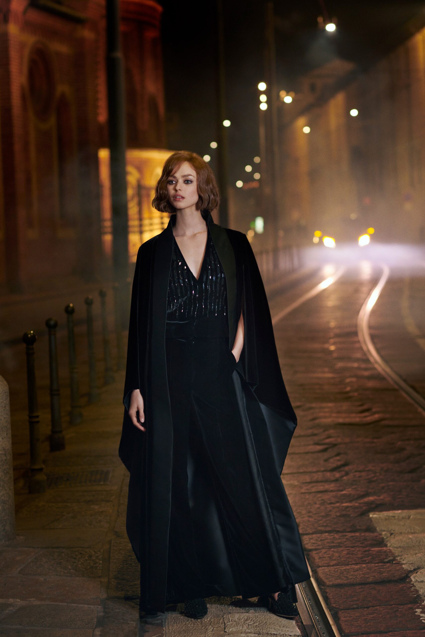 black silk cape and tailored pants