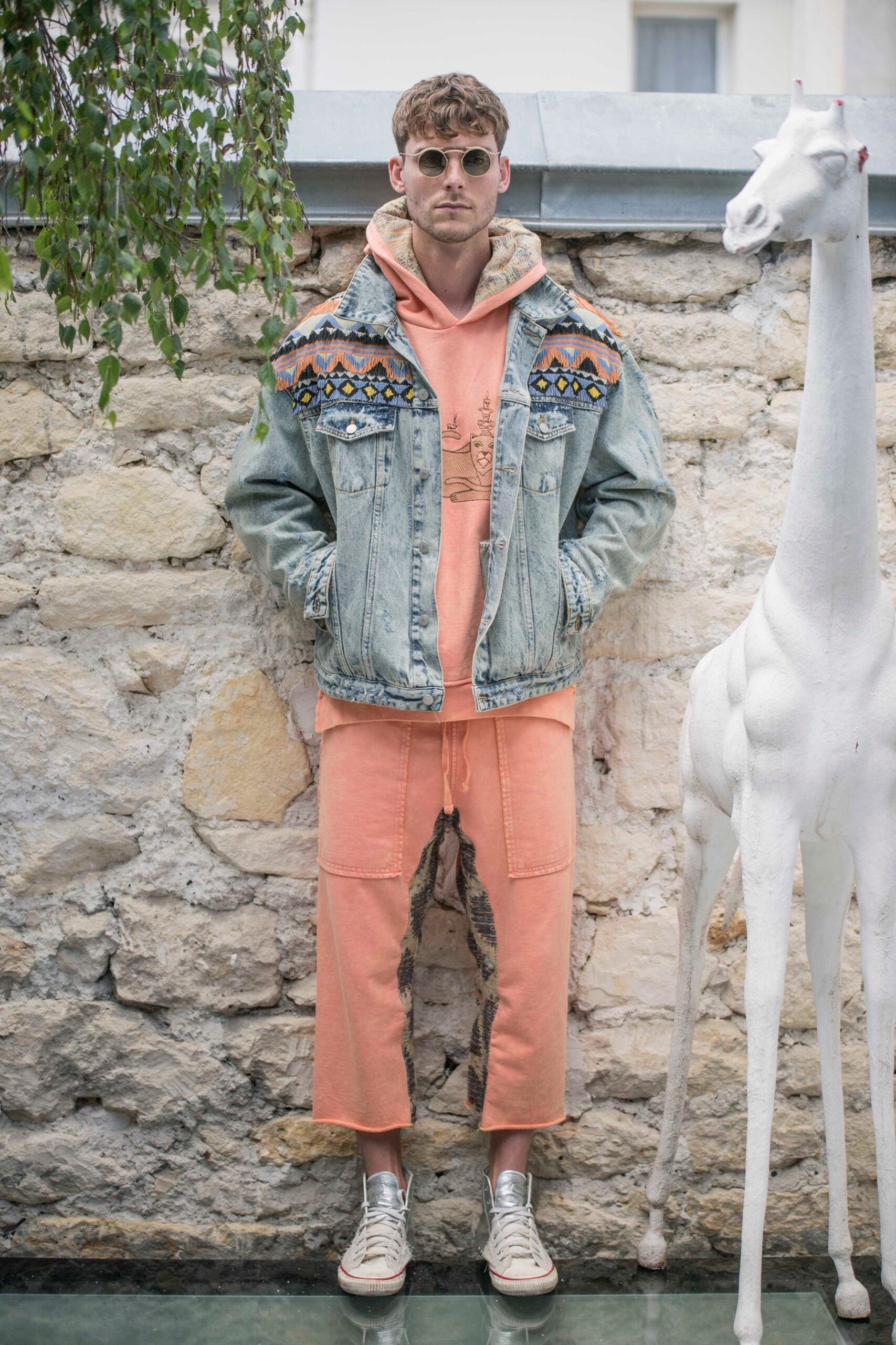 blue denim jacket with orange hoodie