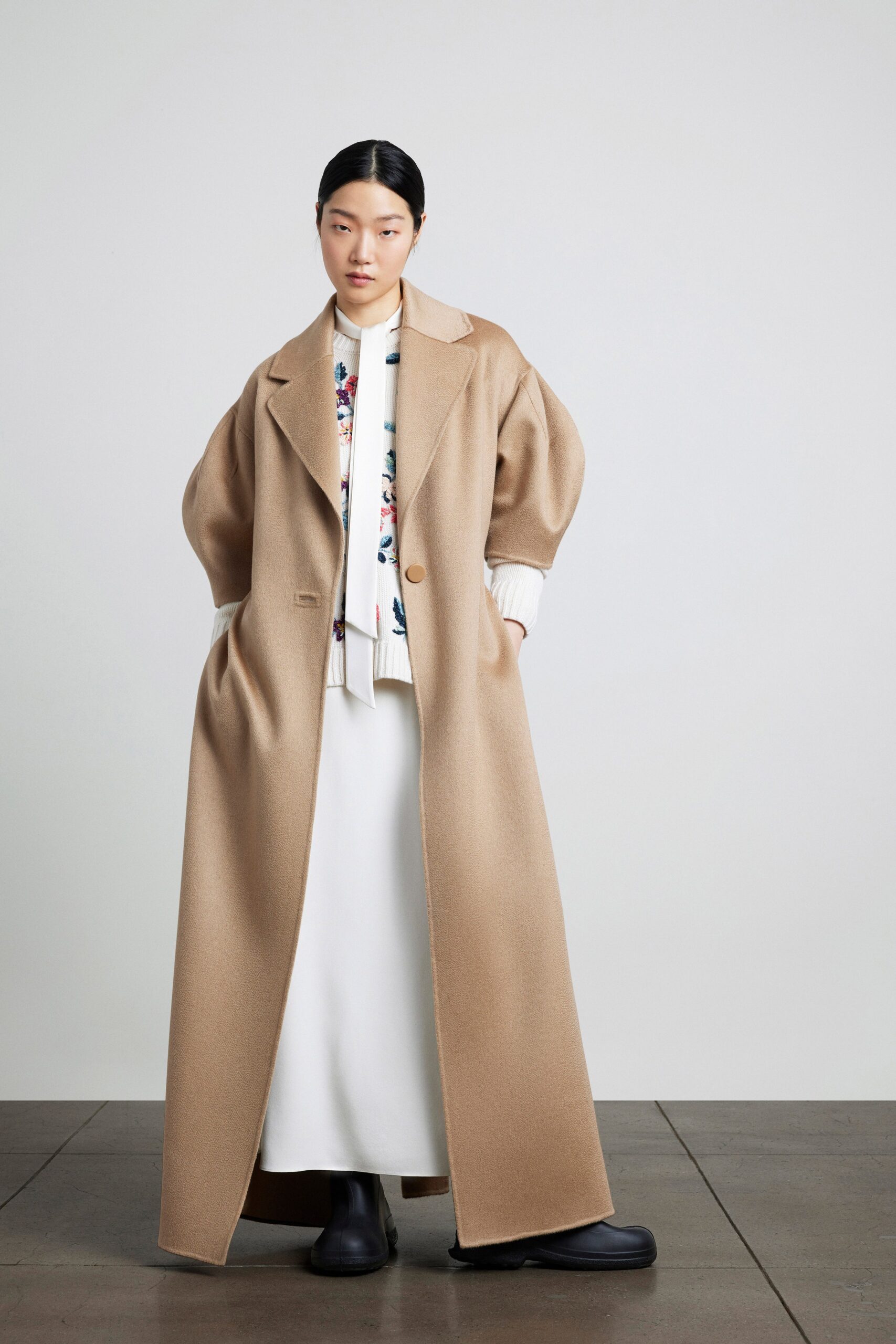 beige oversized coat and white dress