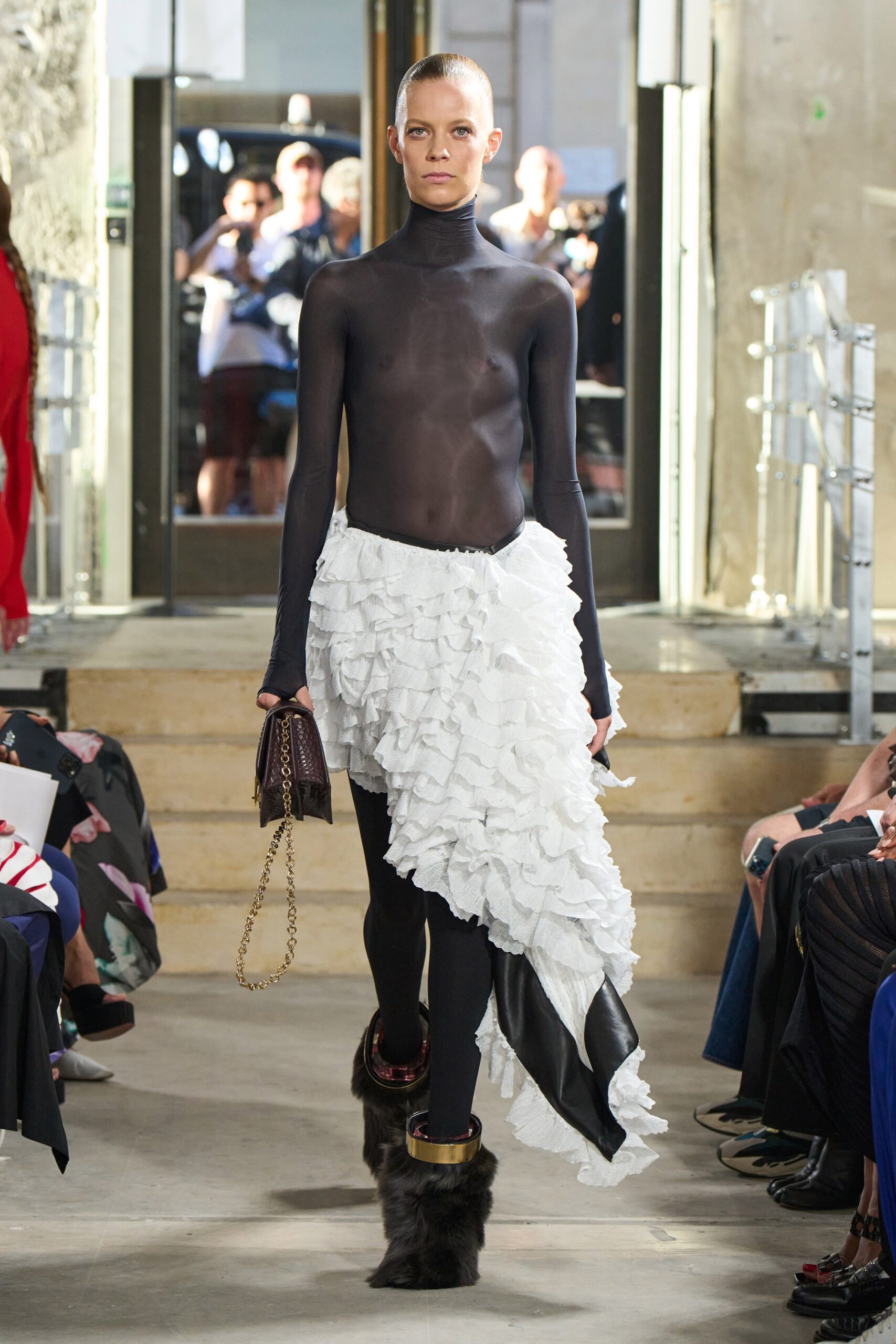 black sheer turtleneck top with ruffled skirt