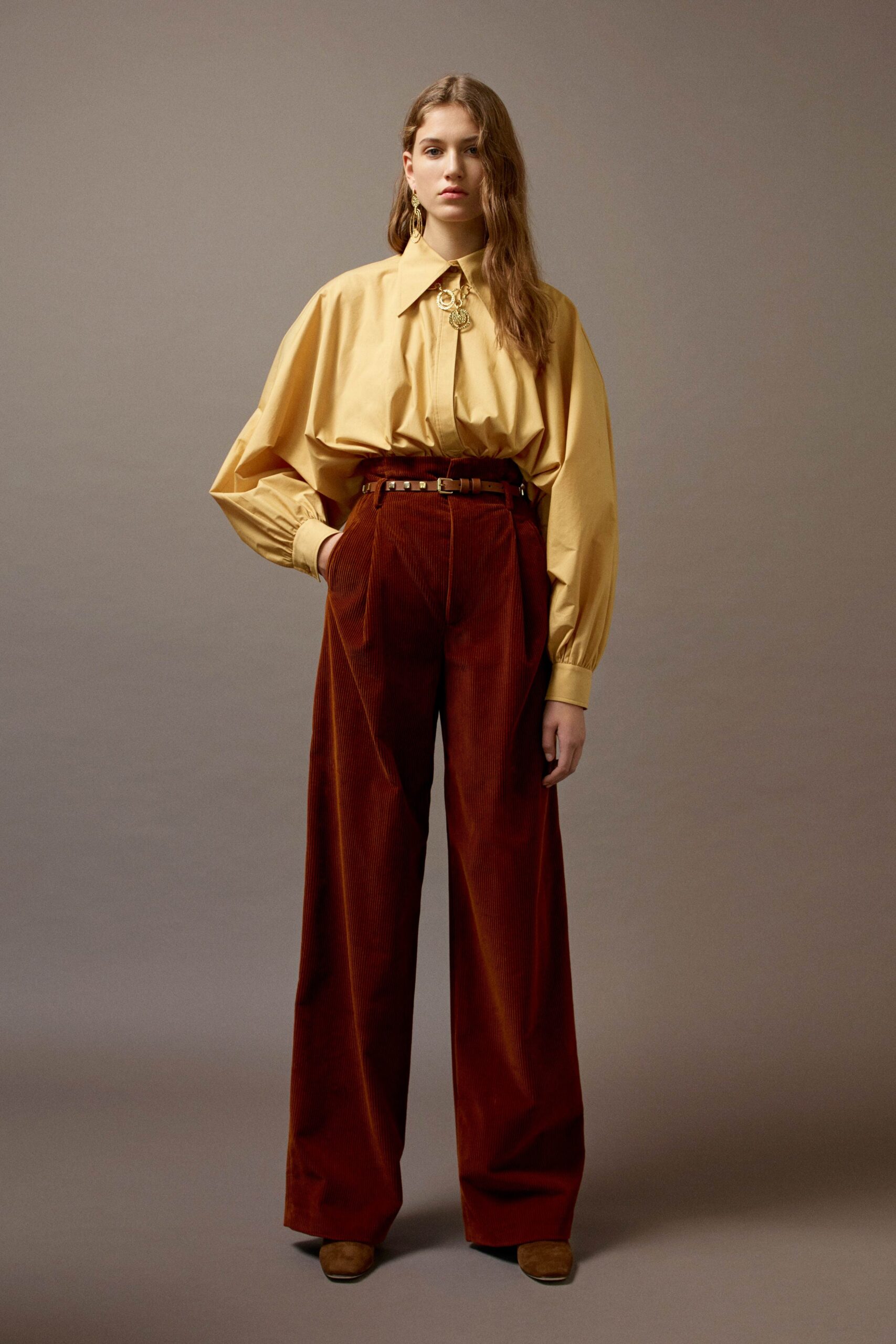 yellow oversized shirt and brown velvet pants