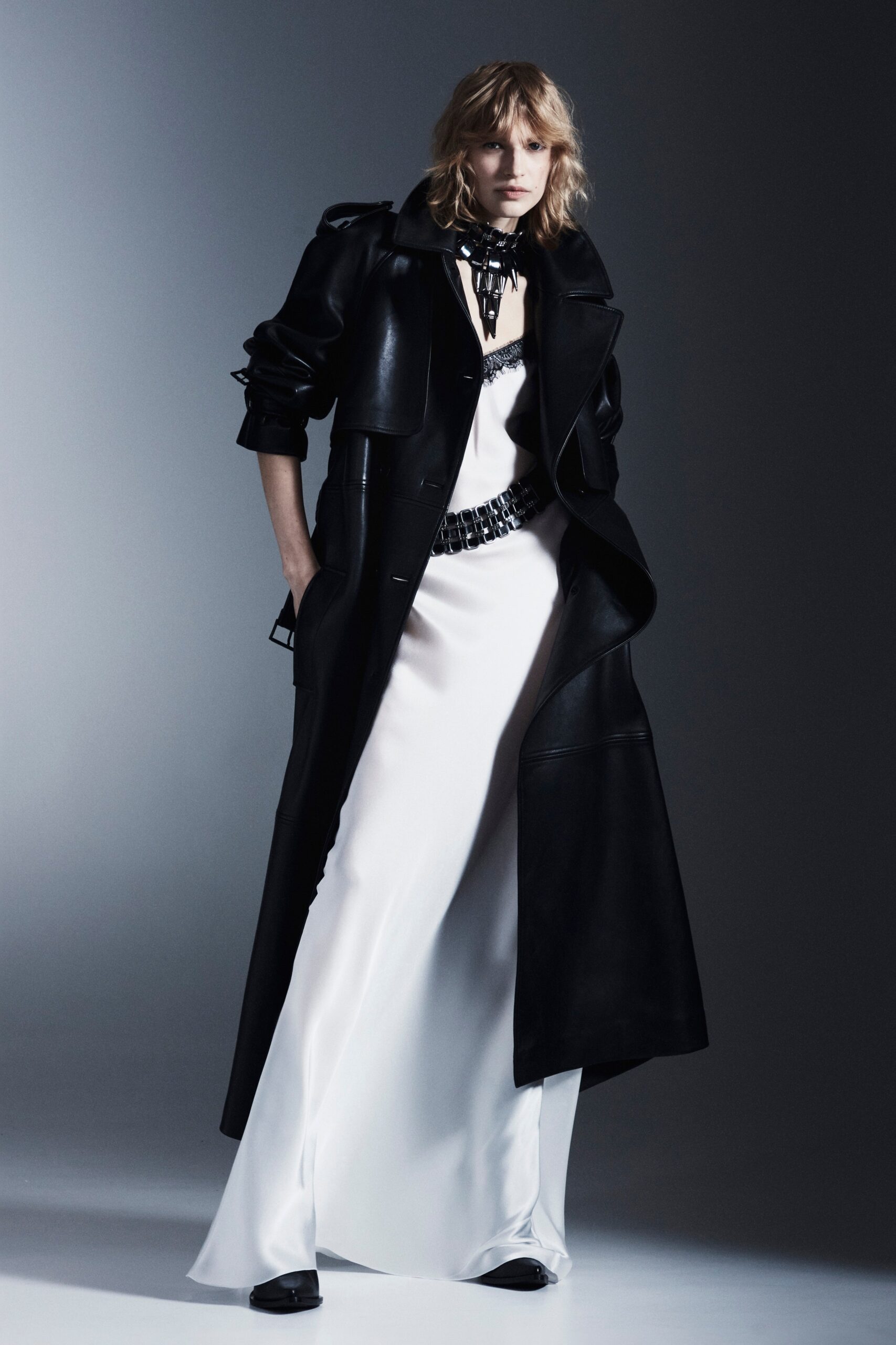black leather coat and white gown
