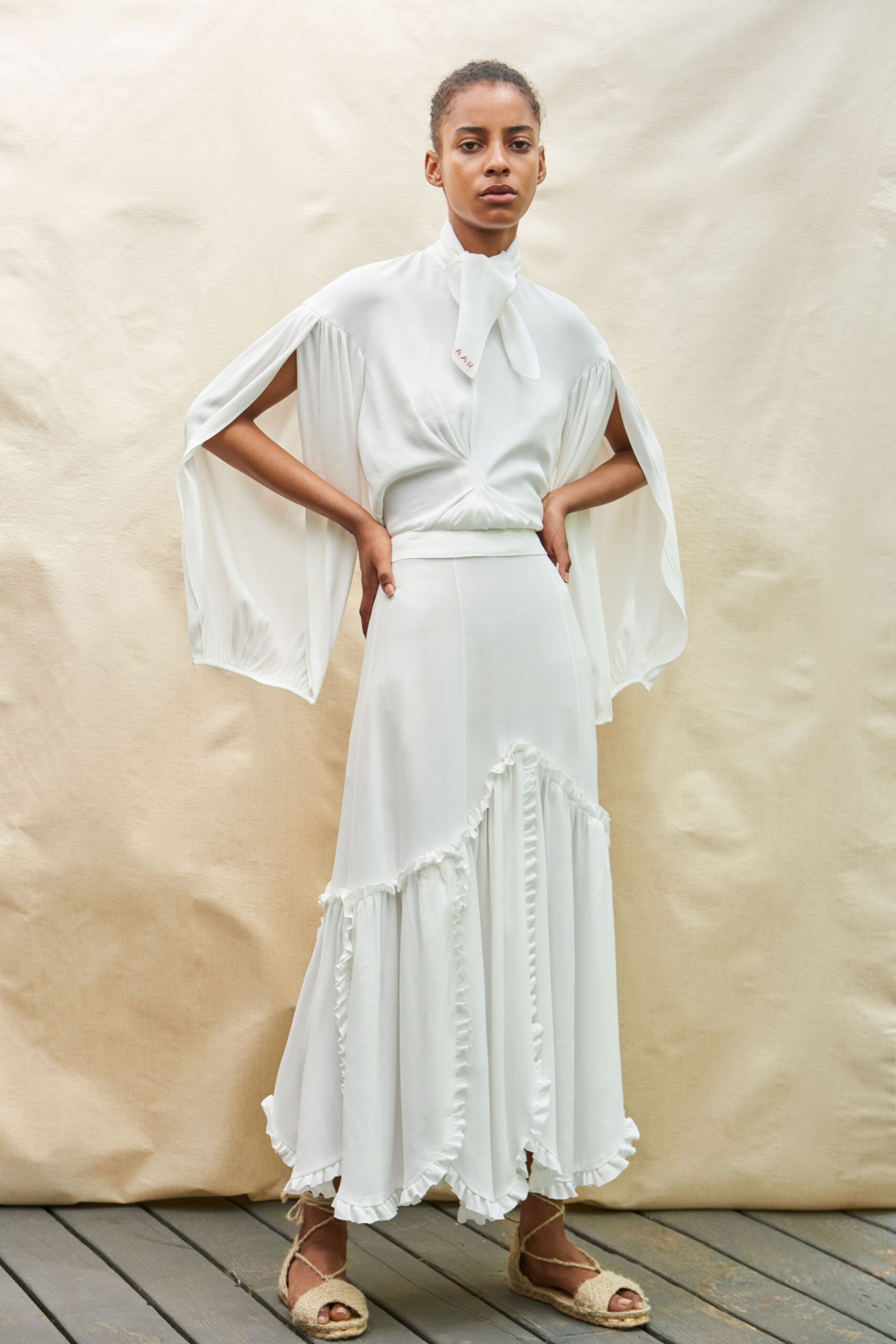 white silk top and skirt