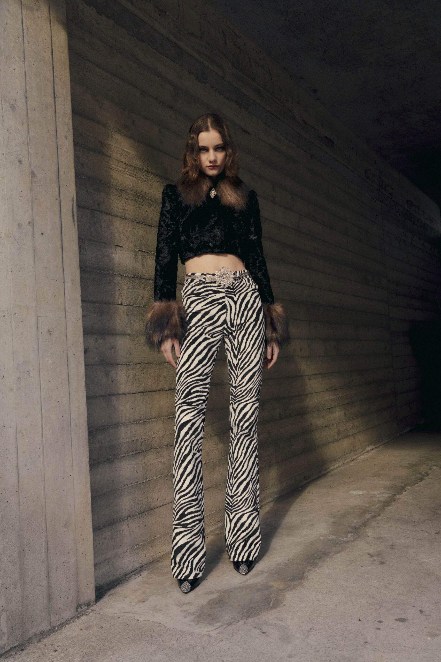 black velvet fitted jacket and zebra-print pants