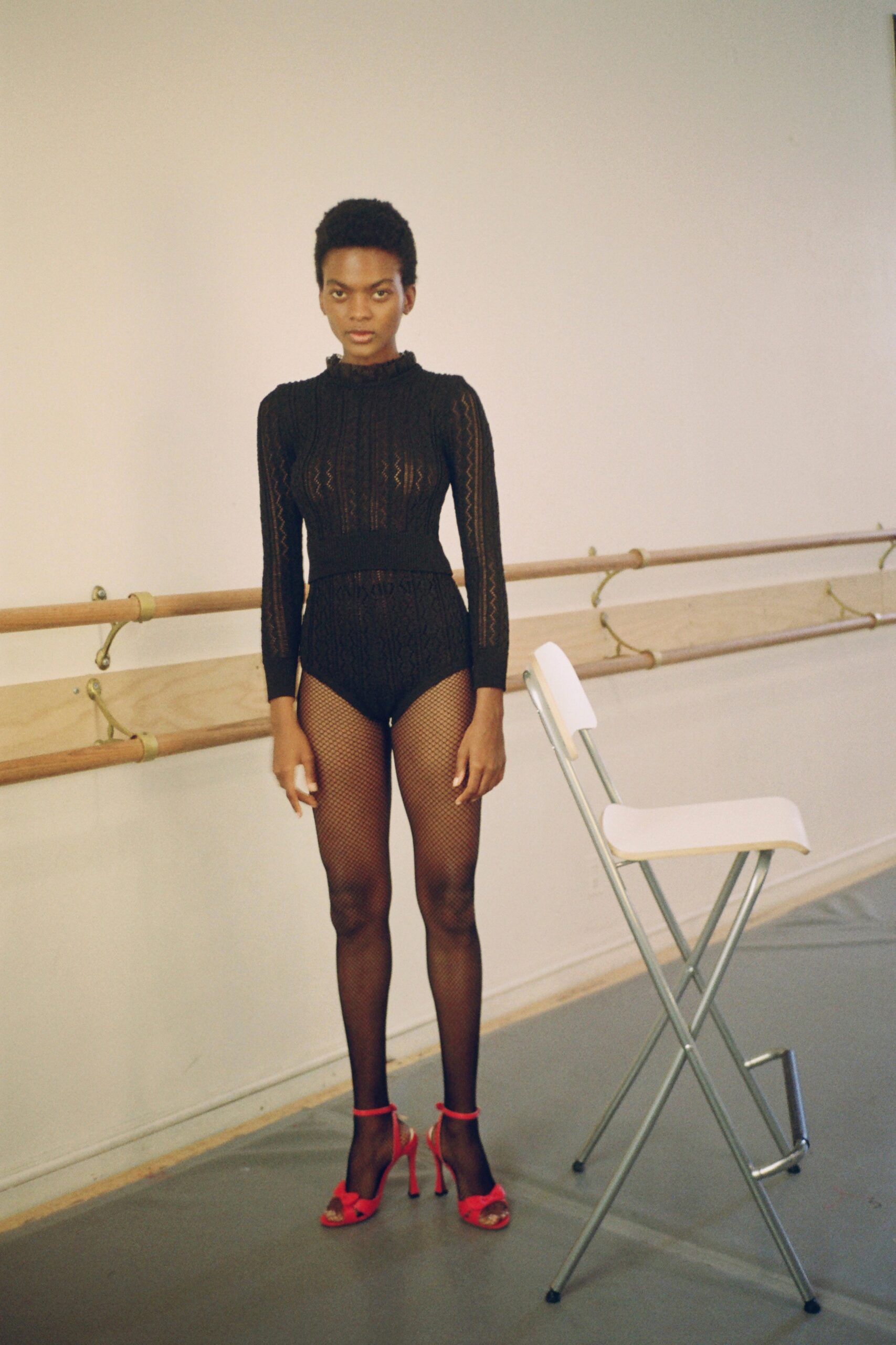 black lace long-sleeve high-neck fitted textured bodysuit
