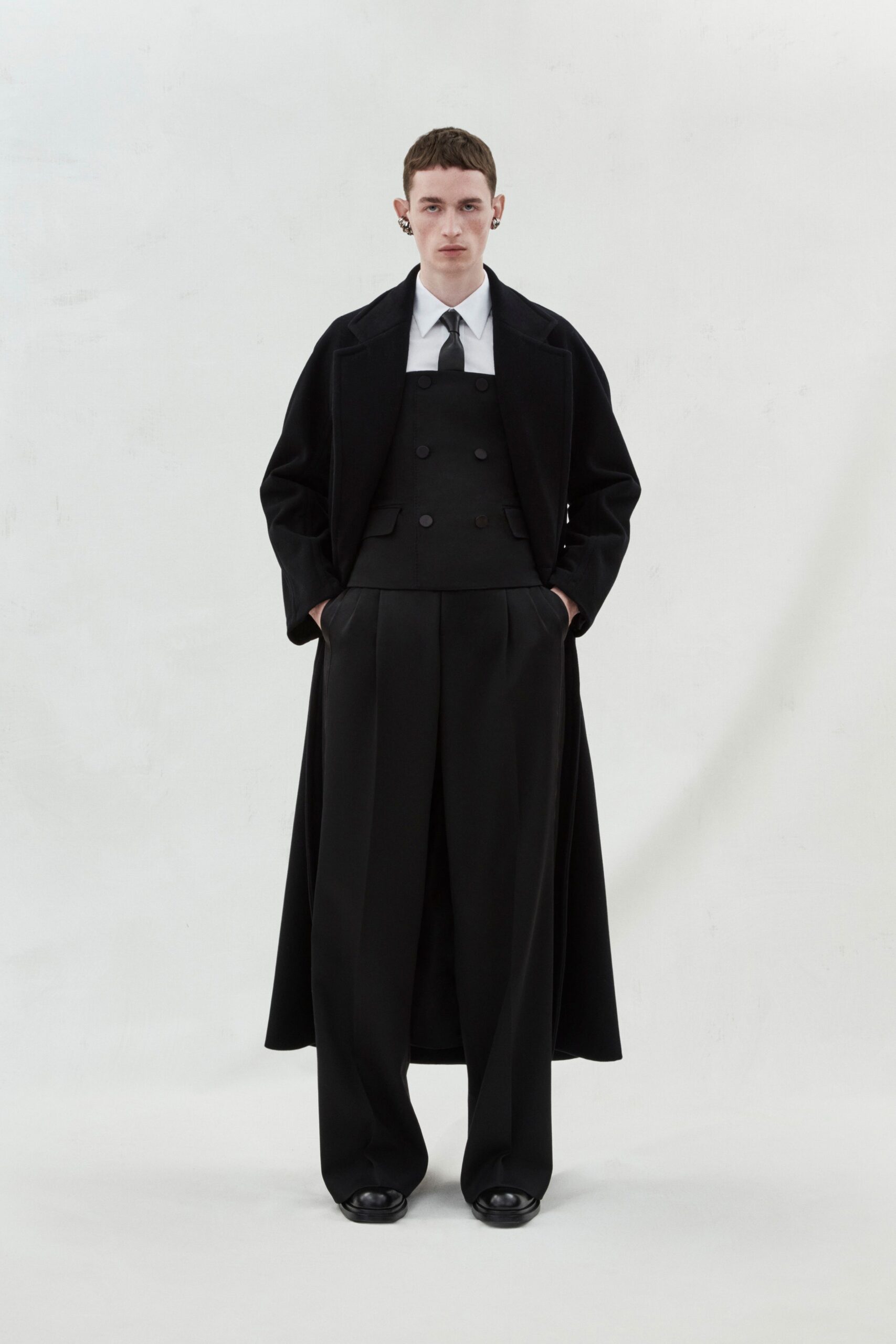 black wool coat and jumpsuit